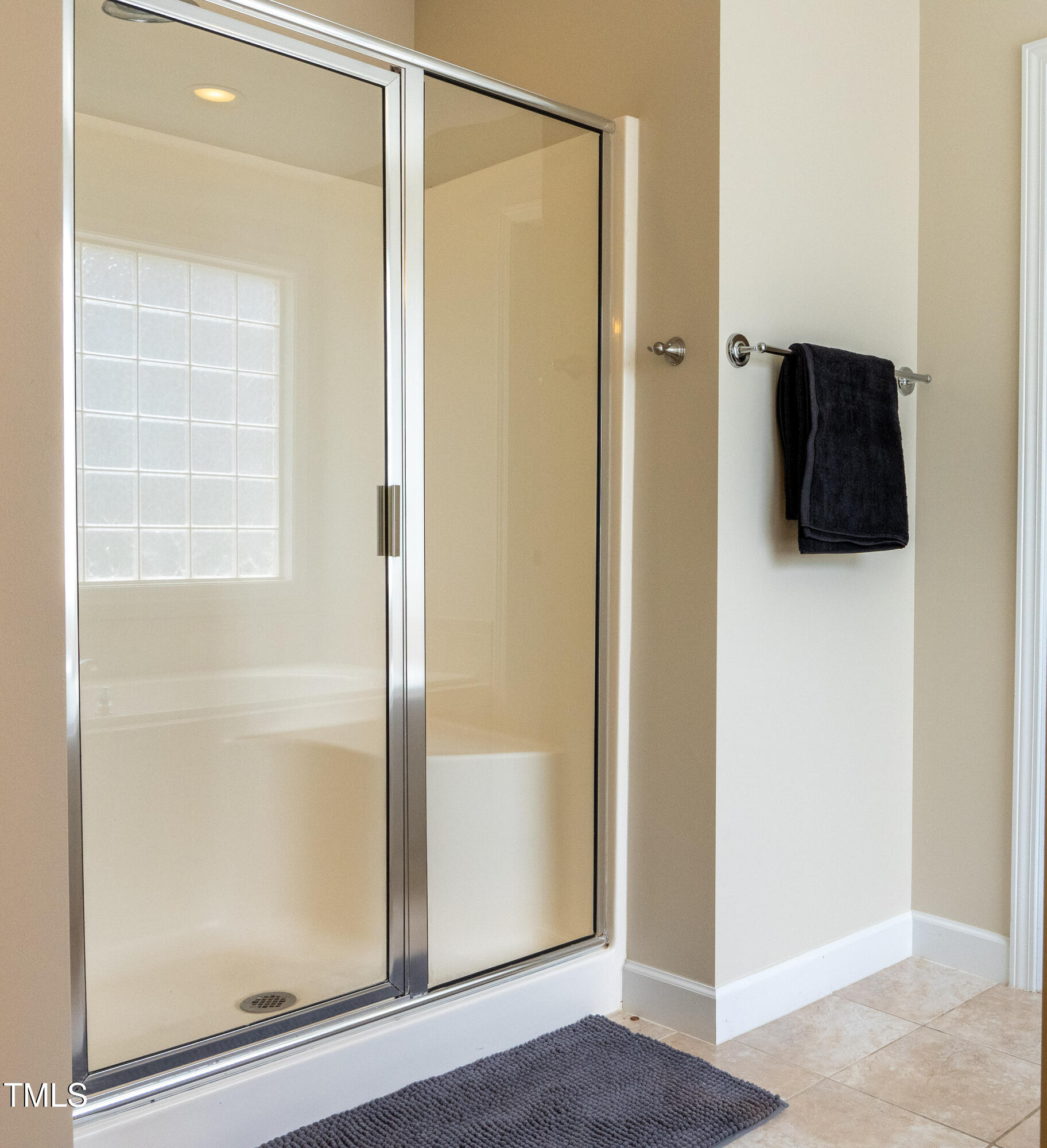 5944 Kohler Lane Raleigh, NC 27616 - Photo 16 of 26 a bathroom with a shower and a mirror