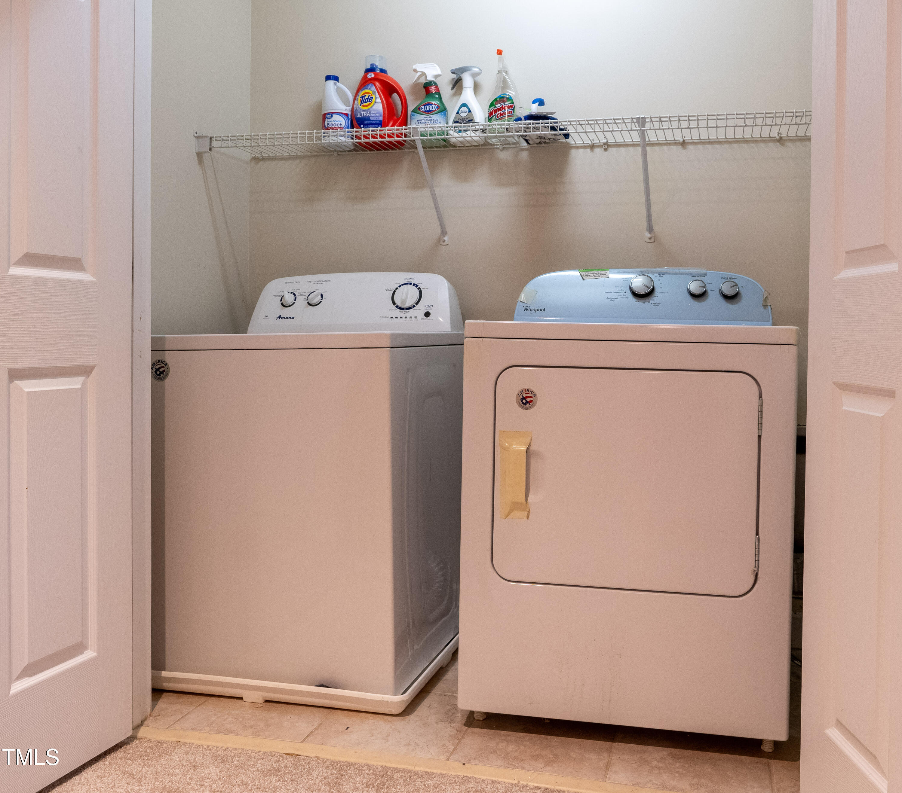 5944 Kohler Lane Raleigh, NC 27616 - Photo 22 of 26 a utility room with dryer washer and storage racks