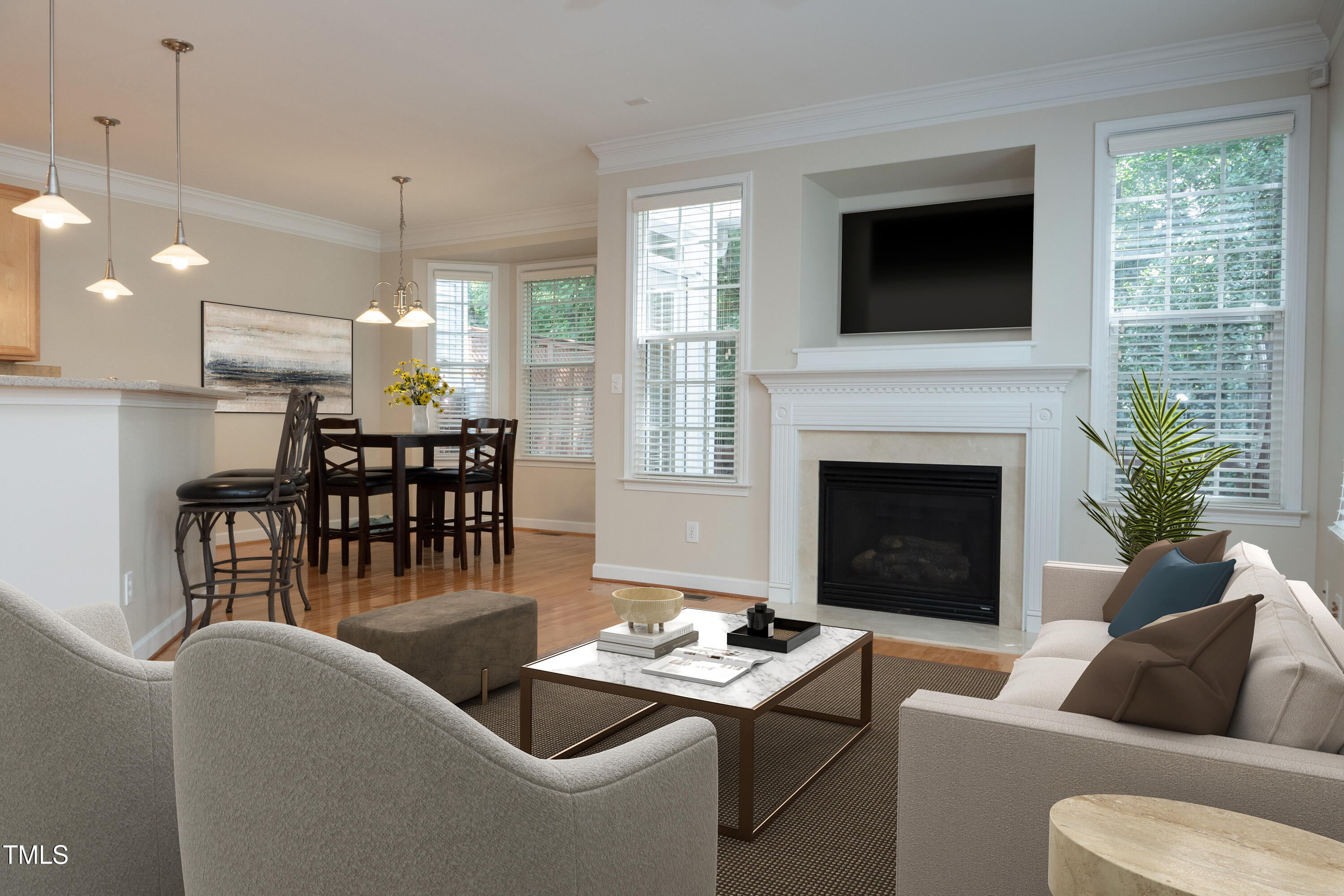 5944 Kohler Lane Raleigh, NC 27616 - Photo 6 of 26 a living room with furniture a flat screen tv and a fireplace