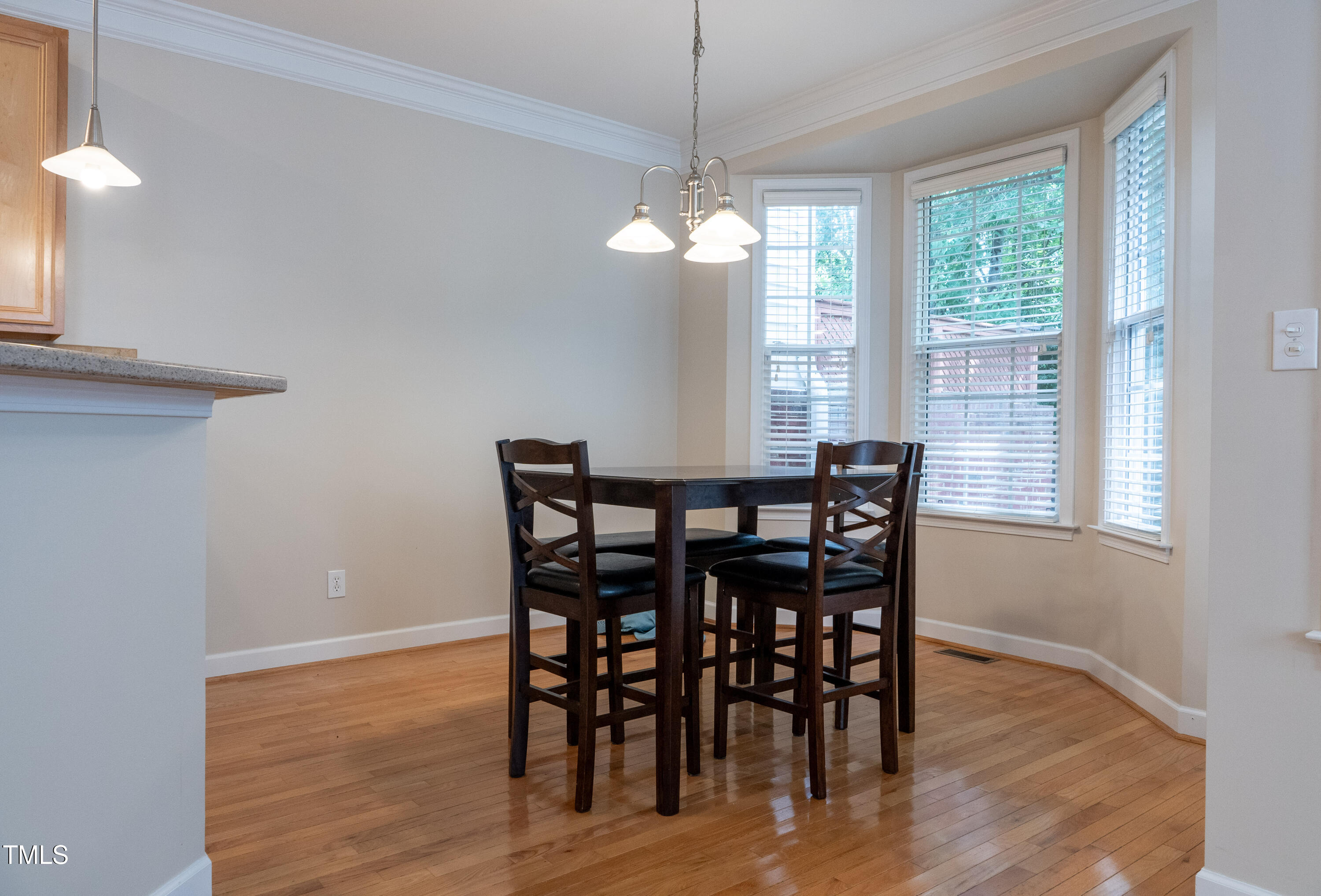 5944 Kohler Lane Raleigh, NC 27616 - Photo 8 of 26 a view of a dining room with furniture window and wooden floor