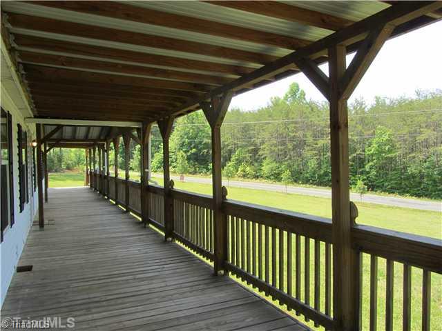 1901 Martin Farm Road Madison, NC 27025 - Photo 3 of 16 Exterior Front. 8ft X 76 ft Covered Front porch