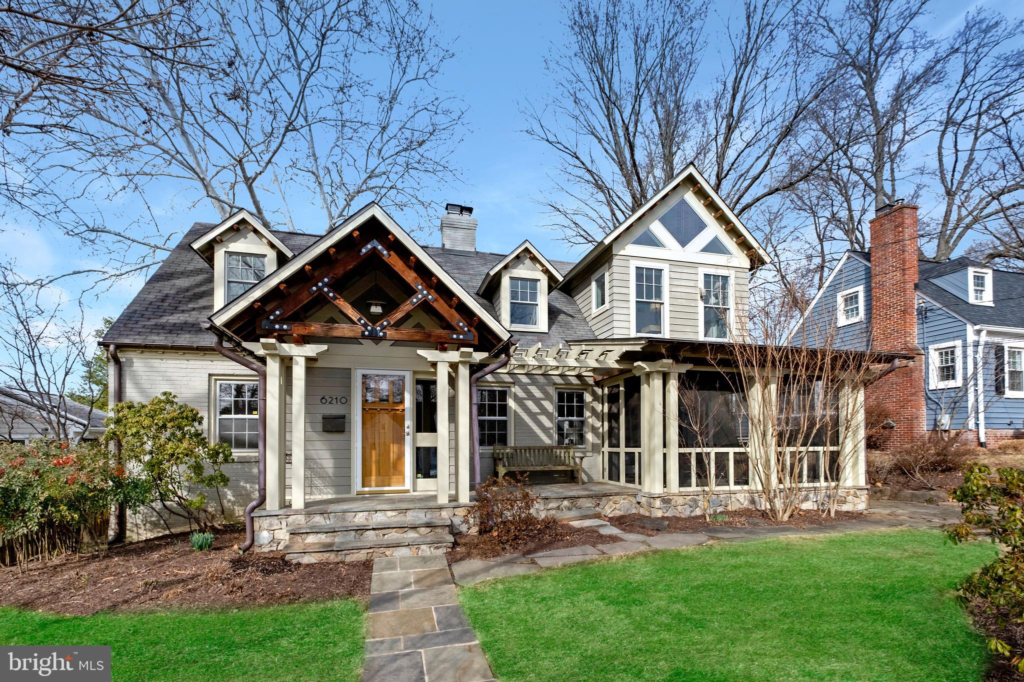 6210 Wagner Lane Bethesda, MD 20816 - Photo 1 of 31 front view of a house with a yard