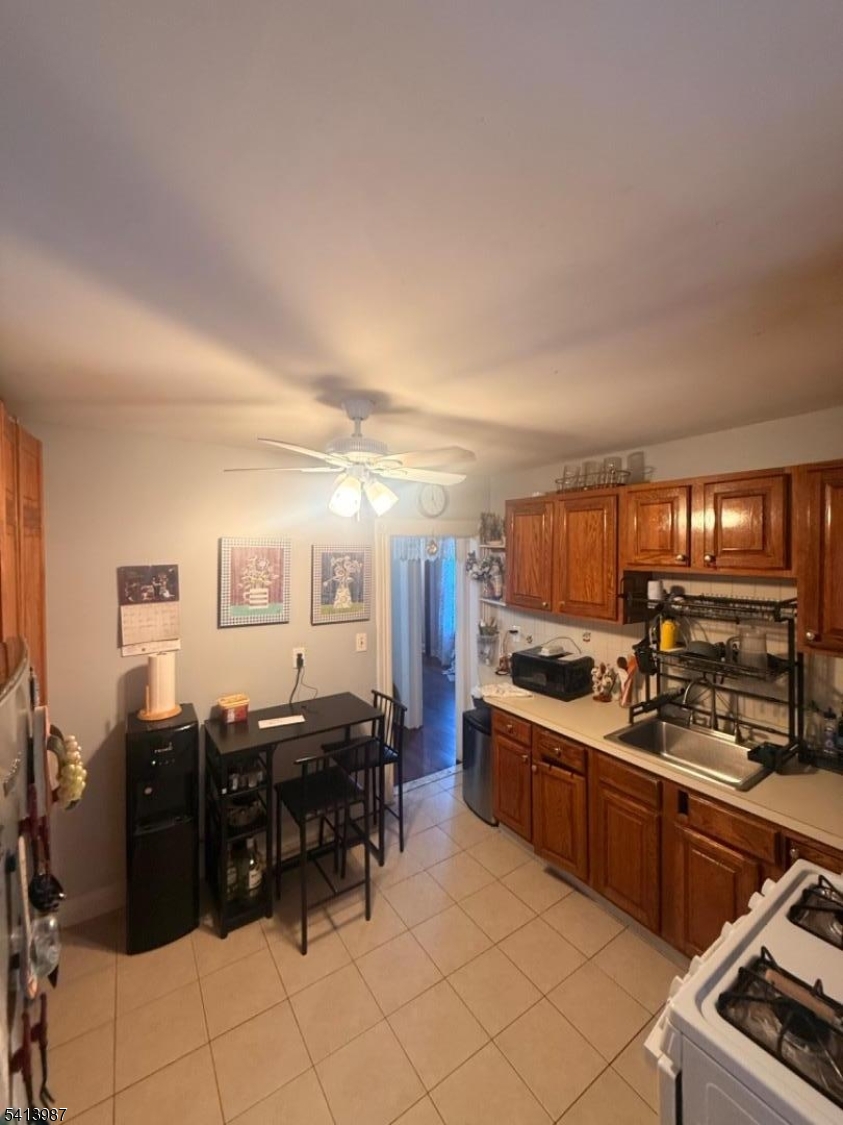 5 Dewey Street Dover, NJ 07801 - Photo 13 of 18 a kitchen with lots of counter top space and appliances