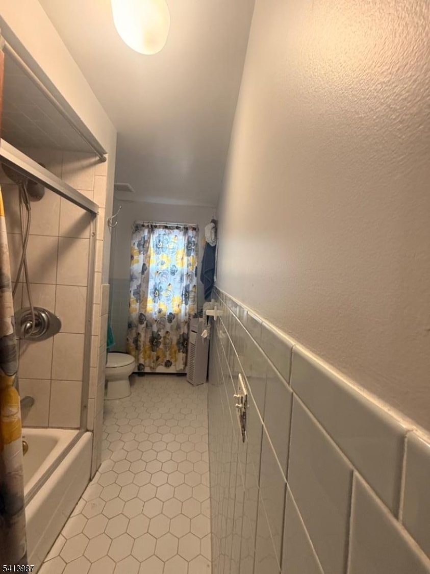 5 Dewey Street Dover, NJ 07801 - Photo 14 of 18 a spacious bathroom with a bathtub and a shower