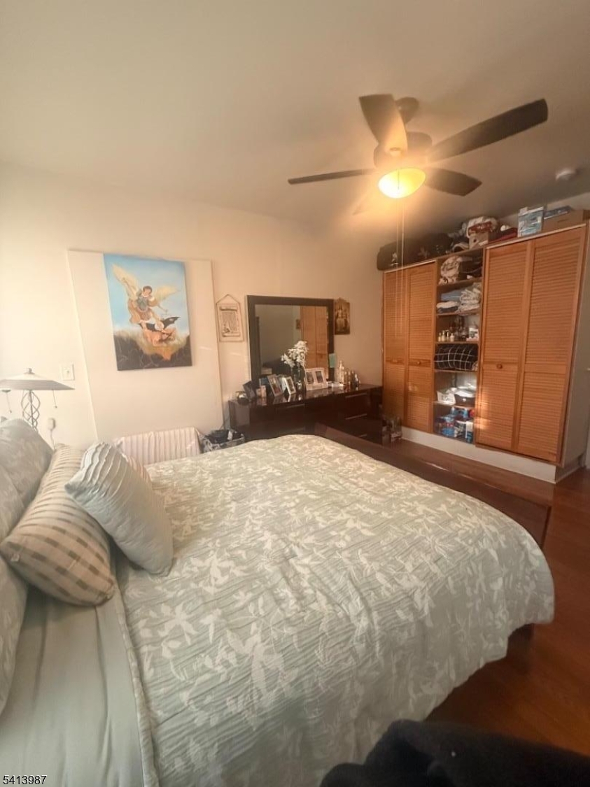 5 Dewey Street Dover, NJ 07801 - Photo 9 of 18 a bed sitting in a bedroom and dressers