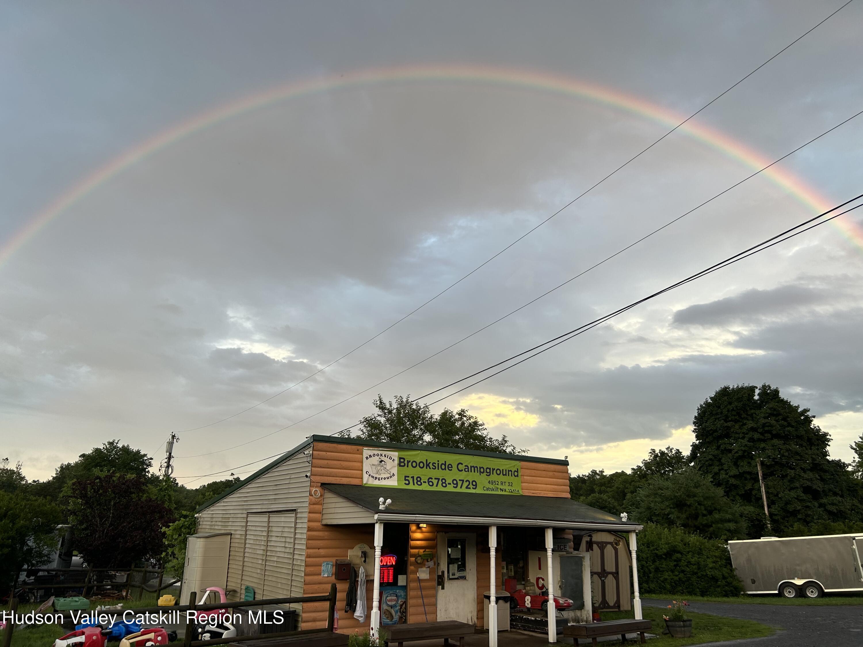 4952 Highway 32 Catskill, NY 12414 - Photo 14 of 19 a front view of a house with a garden and patio