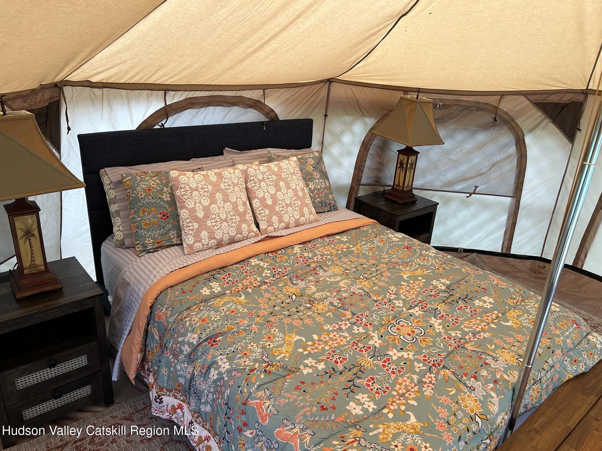 4952 Highway 32 Catskill, NY 12414 - Photo 17 of 19 a bed sitting in a bedroom next to a window