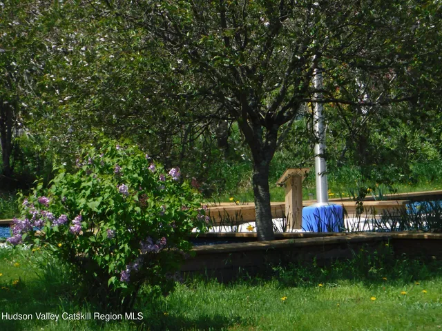 a front view of a house with a garden and patio