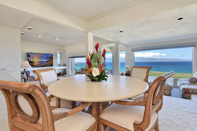 a view of chairs and table in patio