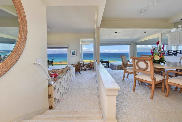 a view of a chairs and table in the patio