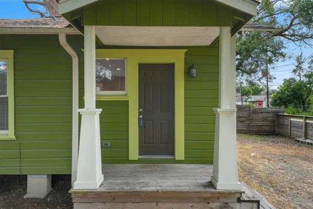 a view of a bird house next to road