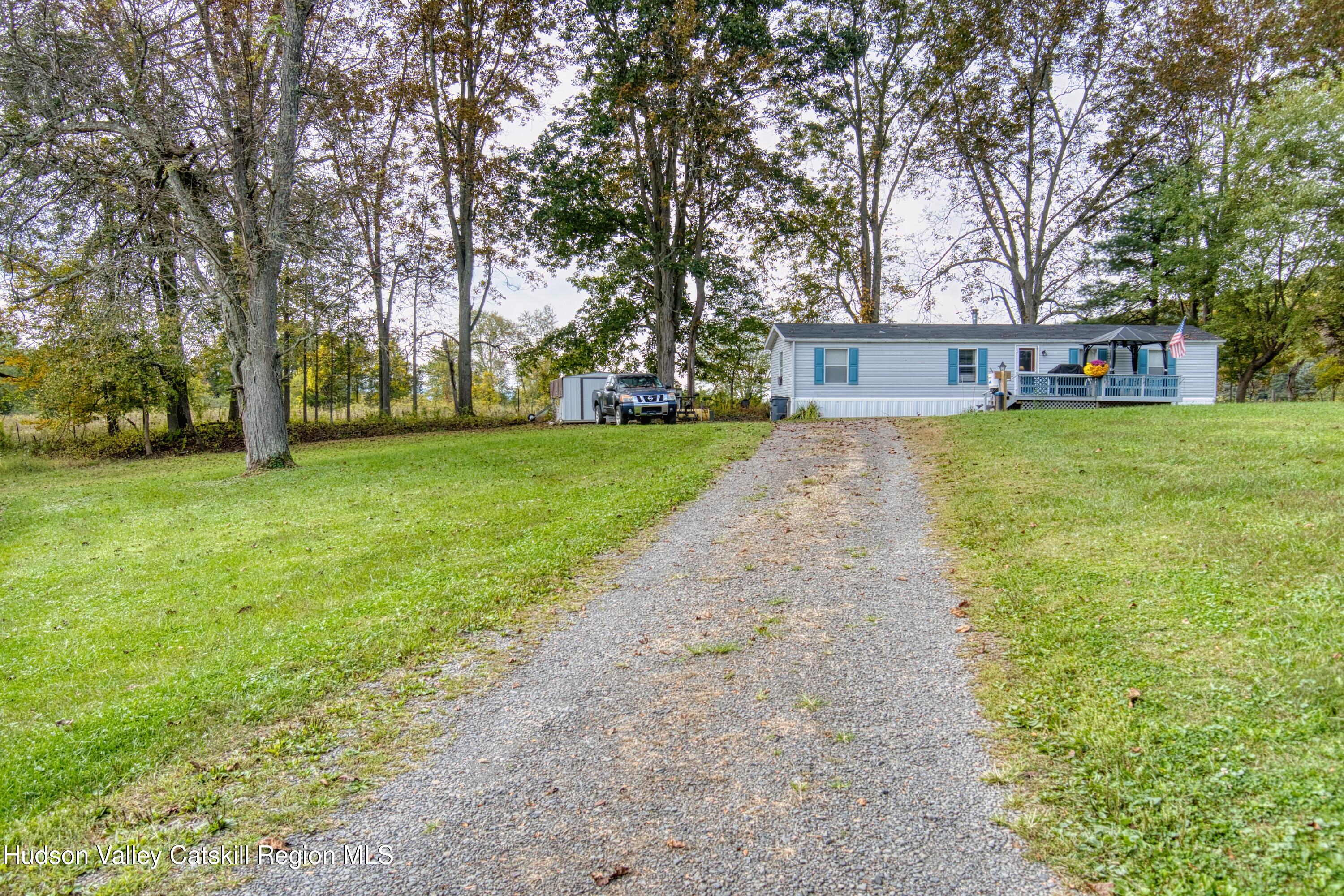 315 Pine Bush Road Stone Ridge, NY 12484 - Photo 14 of 30 a view of a house with a yard