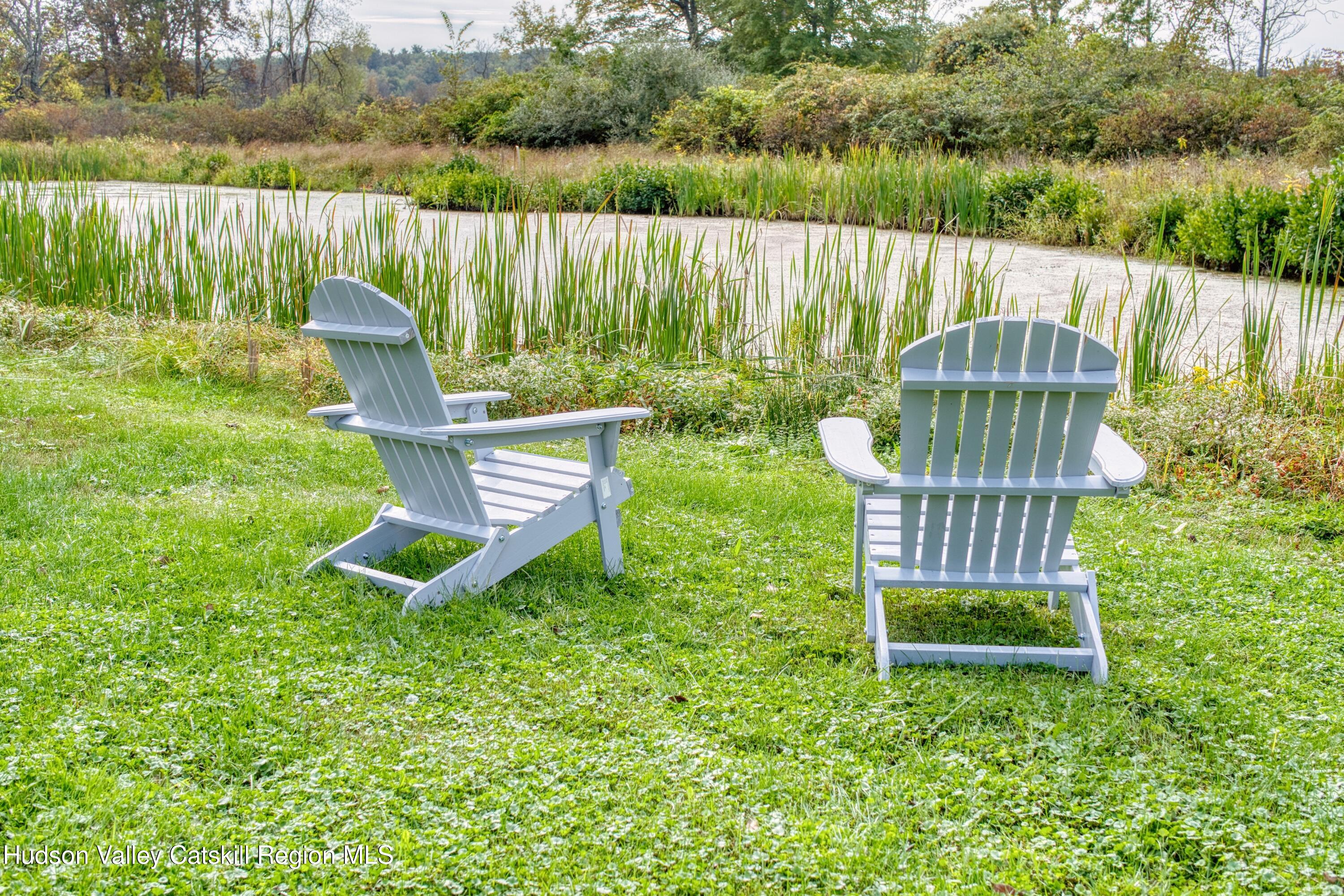 315 Pine Bush Road Stone Ridge, NY 12484 - Photo 4 of 30 a view of a garden with a lake