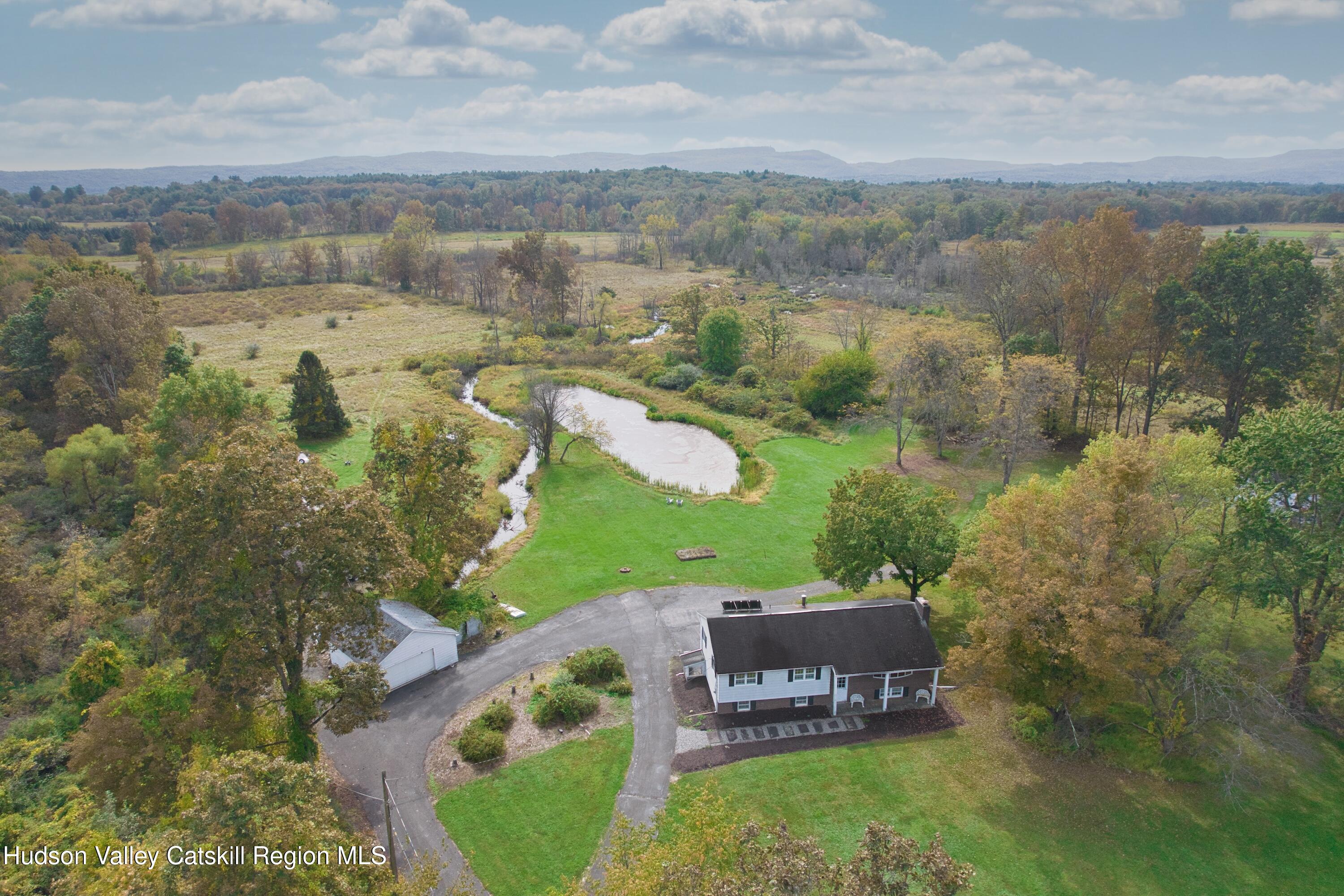 315 Pine Bush Road Stone Ridge, NY 12484 - Photo 10 of 30 an aerial view of a house with a yard and lake view