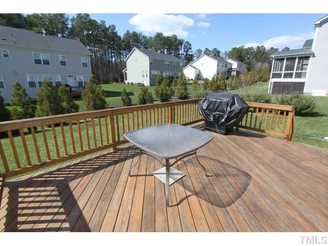 5807 Claribel Court Raleigh, NC 27612 - Photo 21 of 24 New, large deck with upgraded railings & diagonal deck boards replaces the small 10x12 builders' deck! Various trees & landscaping islands added to landscape Patio/Deck