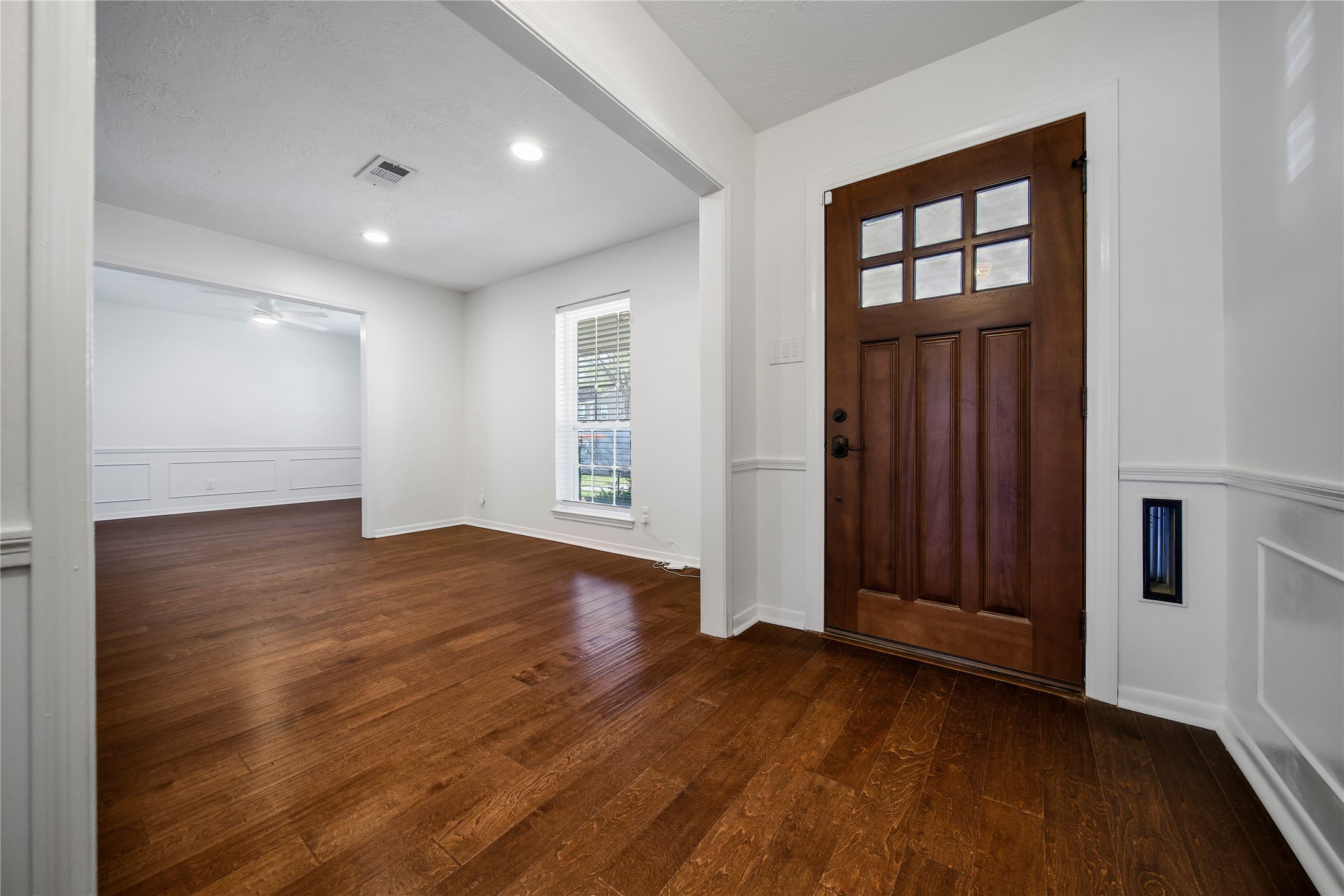955 Thornton Road Houston, TX 77018 - Photo 3 of 27 Stepping through the beautiful craftsman door, you’re greeted immediately to your right by the living and dining room, a bright and welcoming space that sets the tone for the rest of the home.