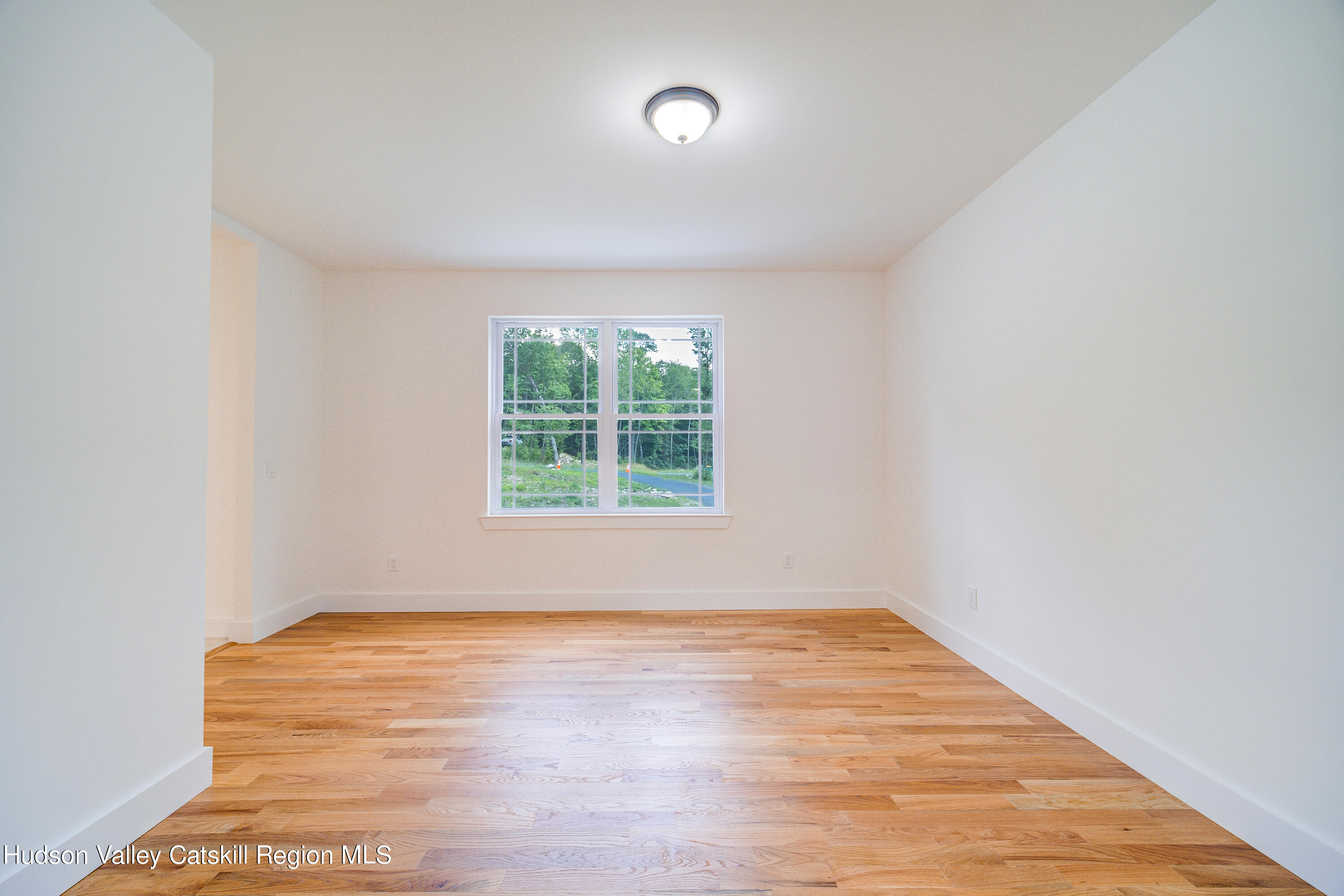 3 Calico Way, Unit WAYS Wallkill, NY 12589 - Photo 11 of 68 an empty room with wooden floor and windows