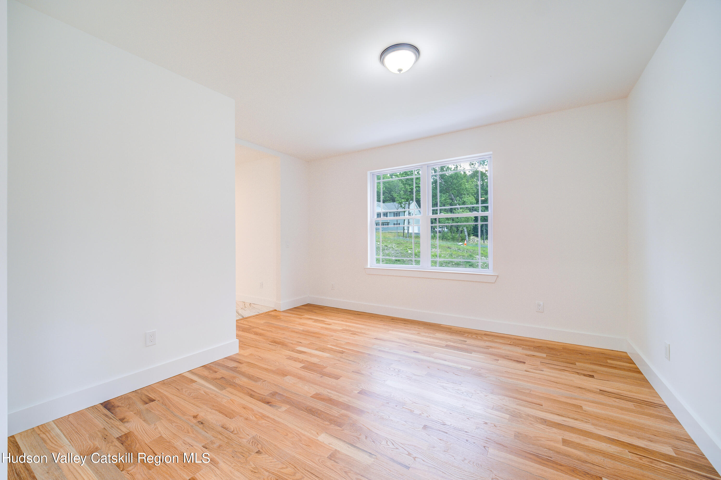 3 Calico Way, Unit WAYS Wallkill, NY 12589 - Photo 12 of 68 an empty room with wooden floor and windows