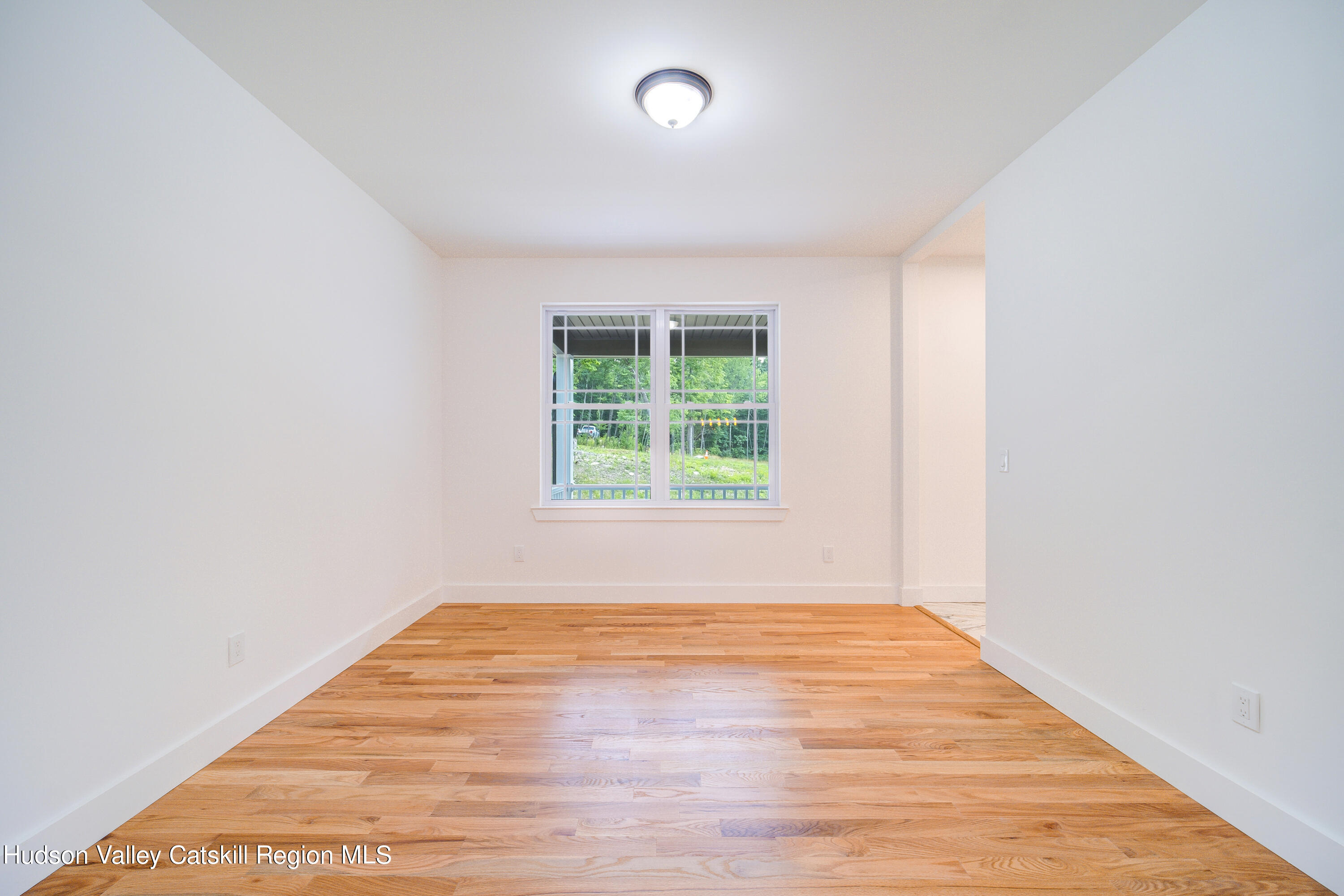 3 Calico Way, Unit WAYS Wallkill, NY 12589 - Photo 16 of 68 an empty room with wooden floor and windows