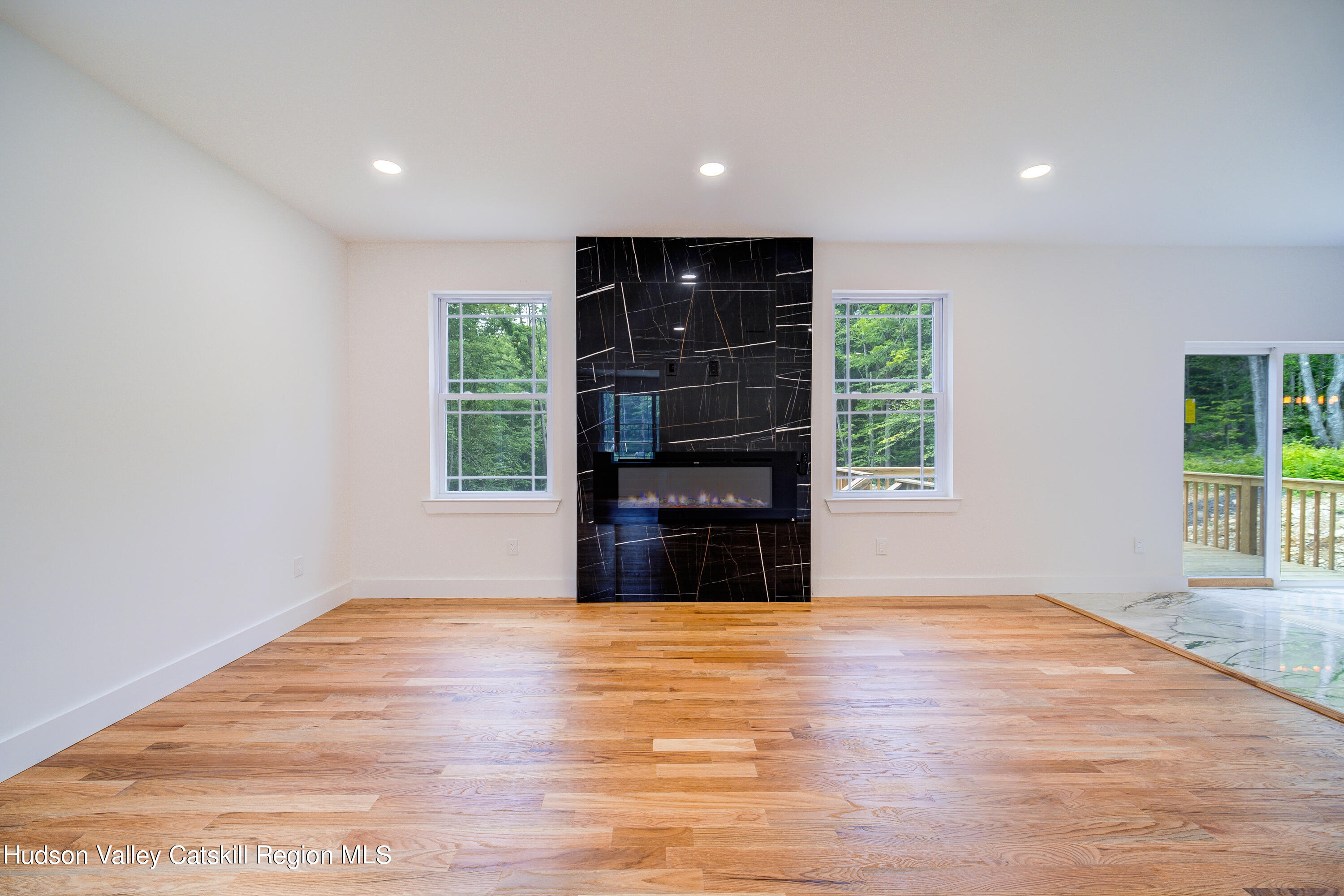 3 Calico Way, Unit WAYS Wallkill, NY 12589 - Photo 17 of 68 a view of an empty room with wooden floor and a window