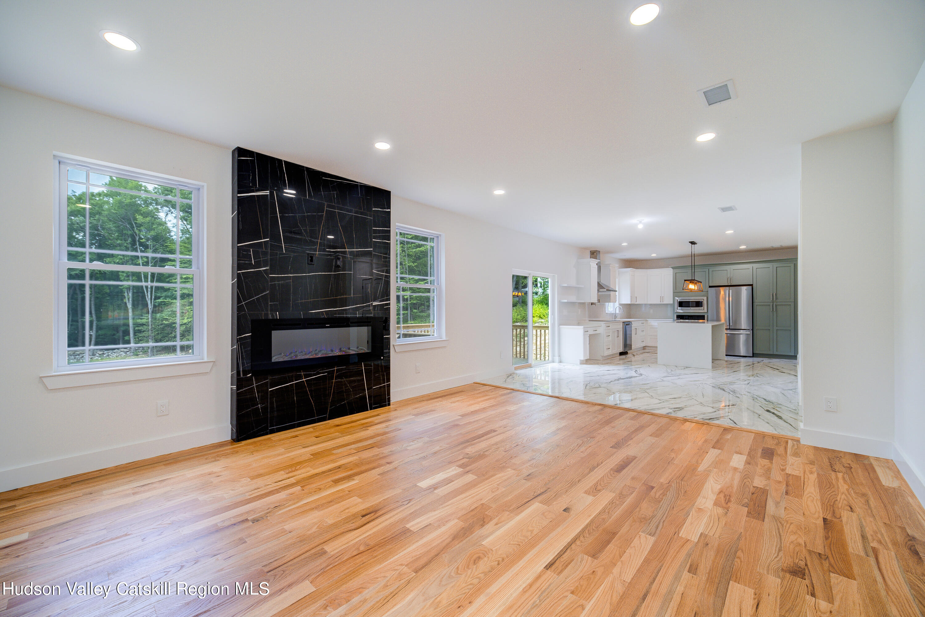 3 Calico Way, Unit WAYS Wallkill, NY 12589 - Photo 19 of 68 a view of empty room with wooden floor and windows