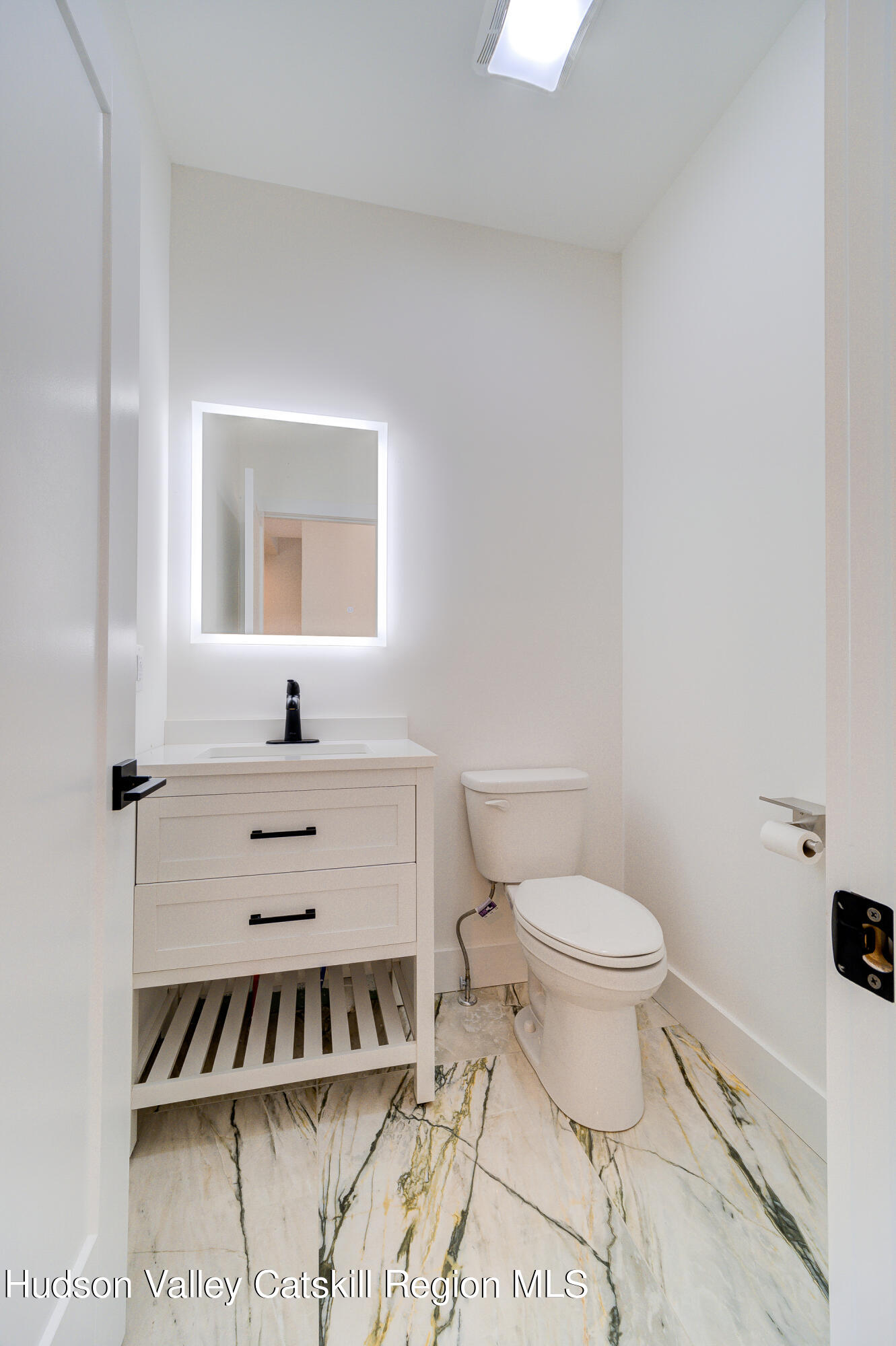3 Calico Way, Unit WAYS Wallkill, NY 12589 - Photo 31 of 68 a bathroom with a toilet a sink and mirror