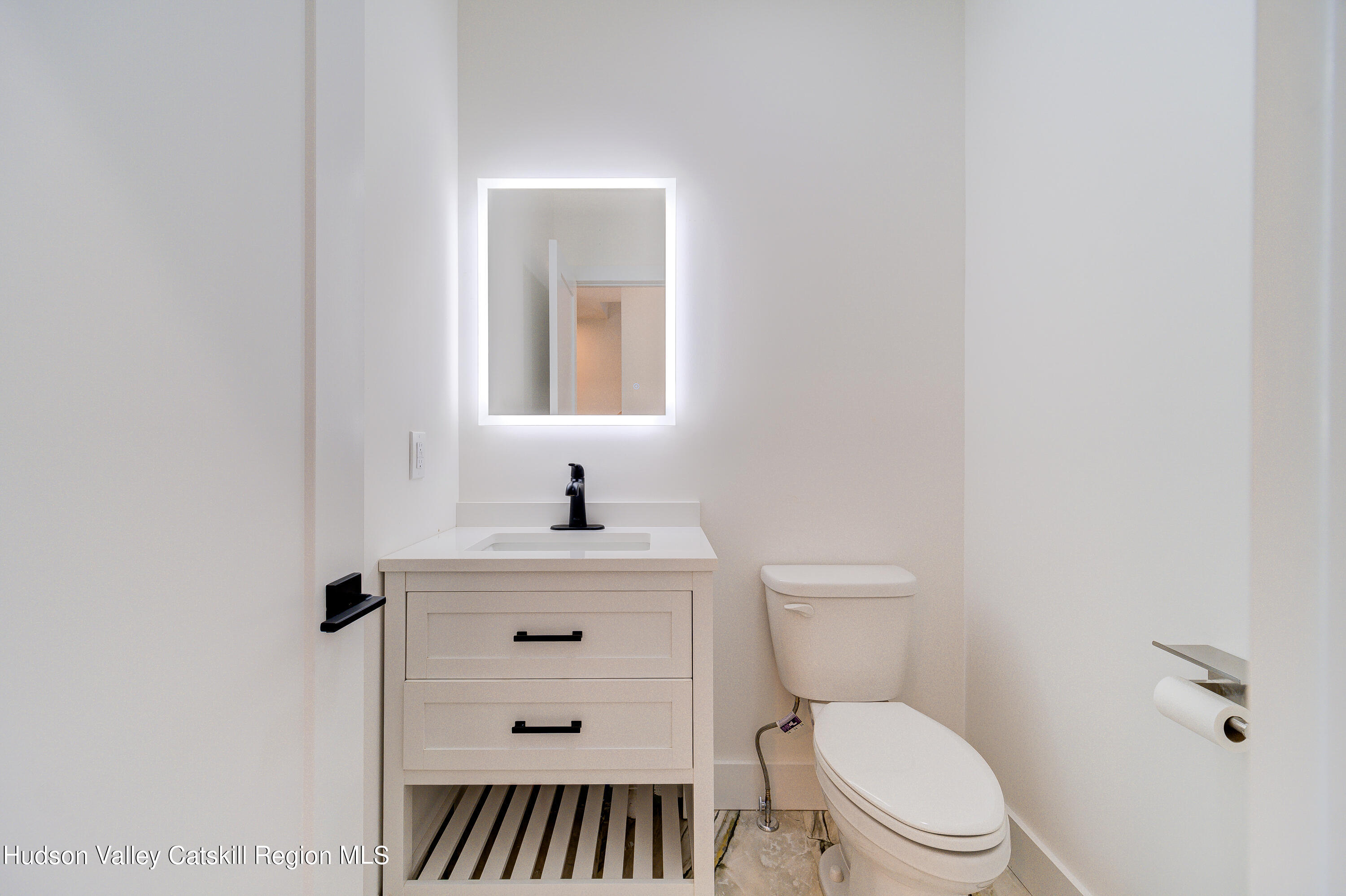 3 Calico Way, Unit WAYS Wallkill, NY 12589 - Photo 32 of 68 a bathroom with a toilet a sink and mirror