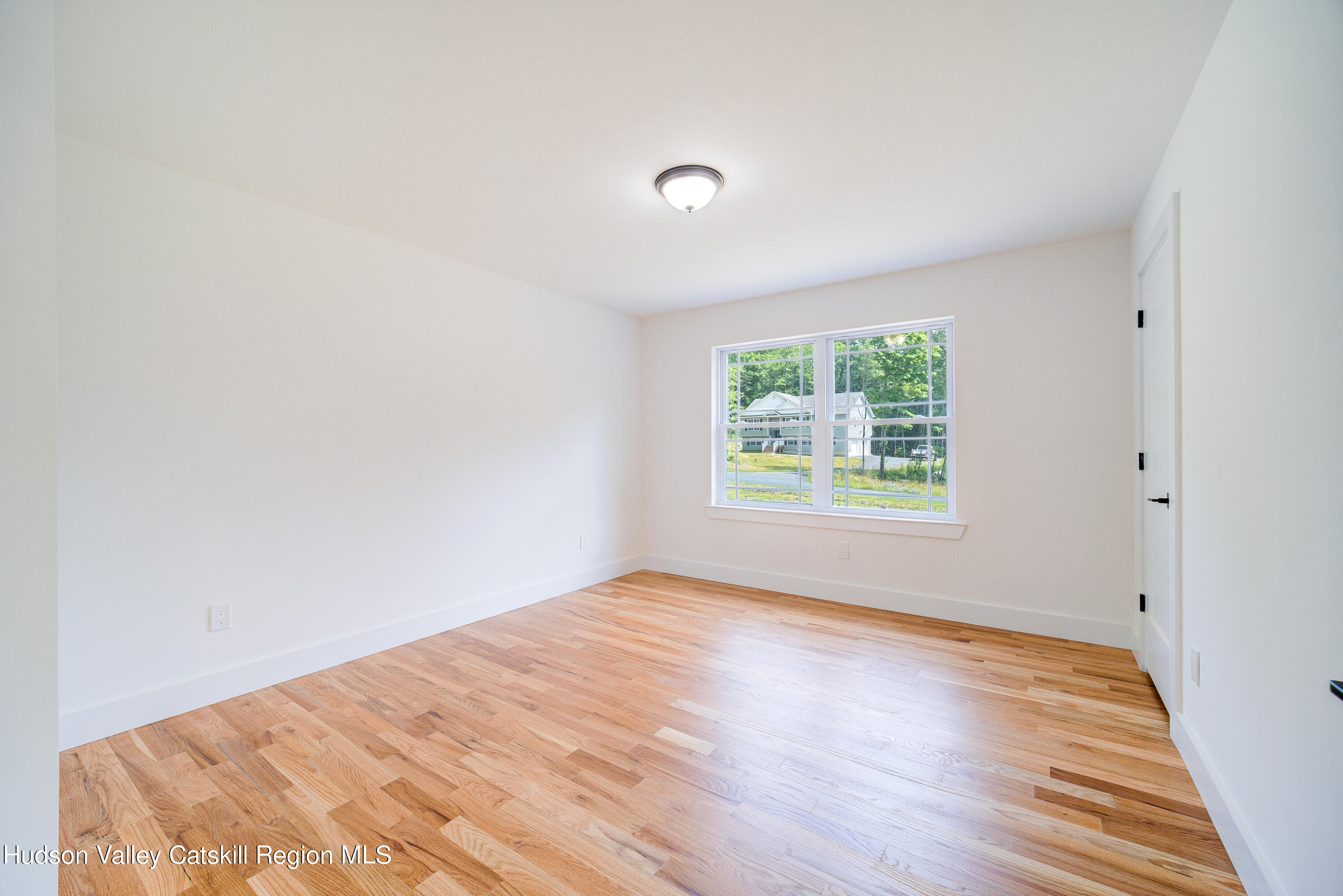 3 Calico Way, Unit WAYS Wallkill, NY 12589 - Photo 37 of 68 a view of a big room with wooden floor and windows in it
