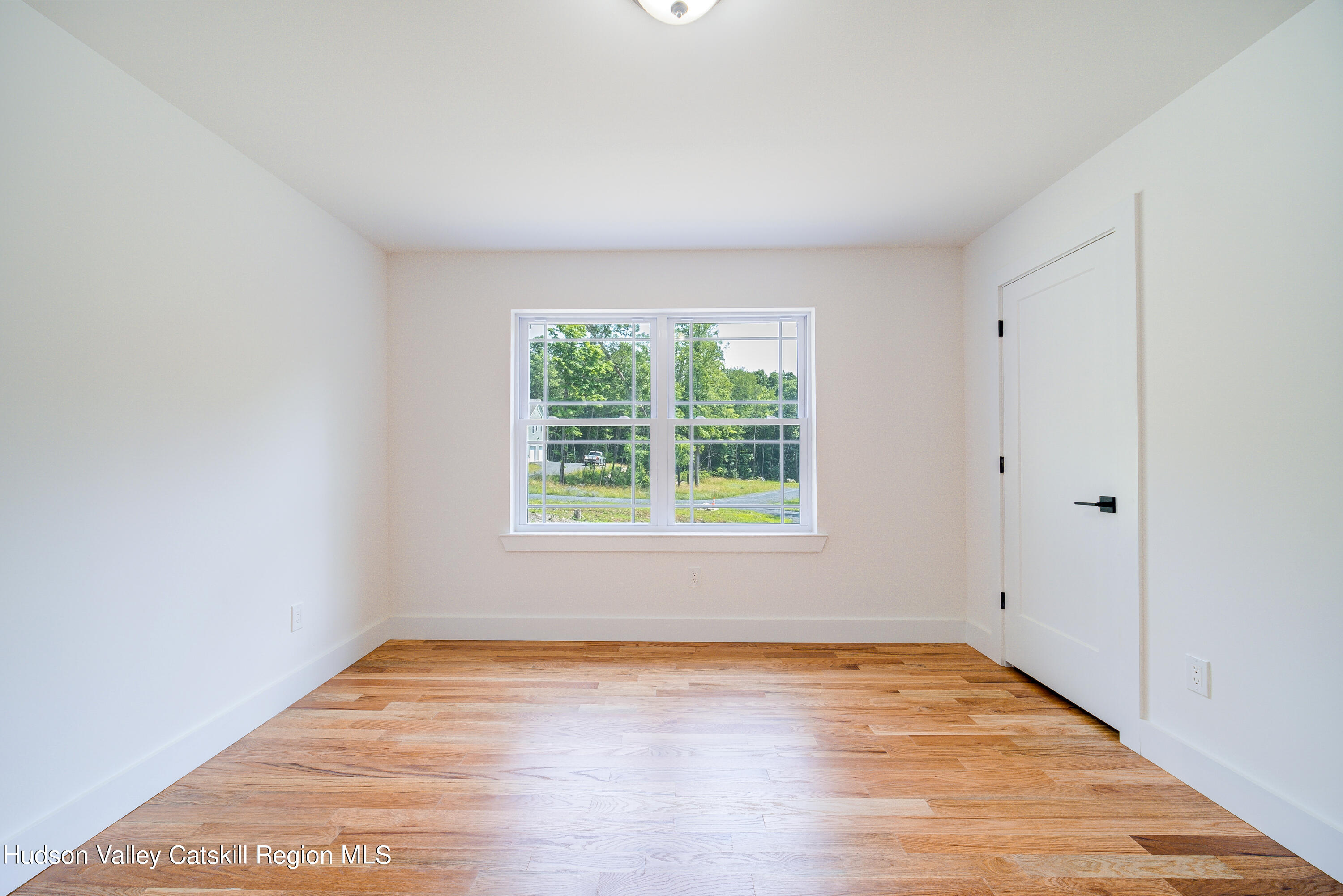 3 Calico Way, Unit WAYS Wallkill, NY 12589 - Photo 38 of 68 an empty room with wooden floor and windows