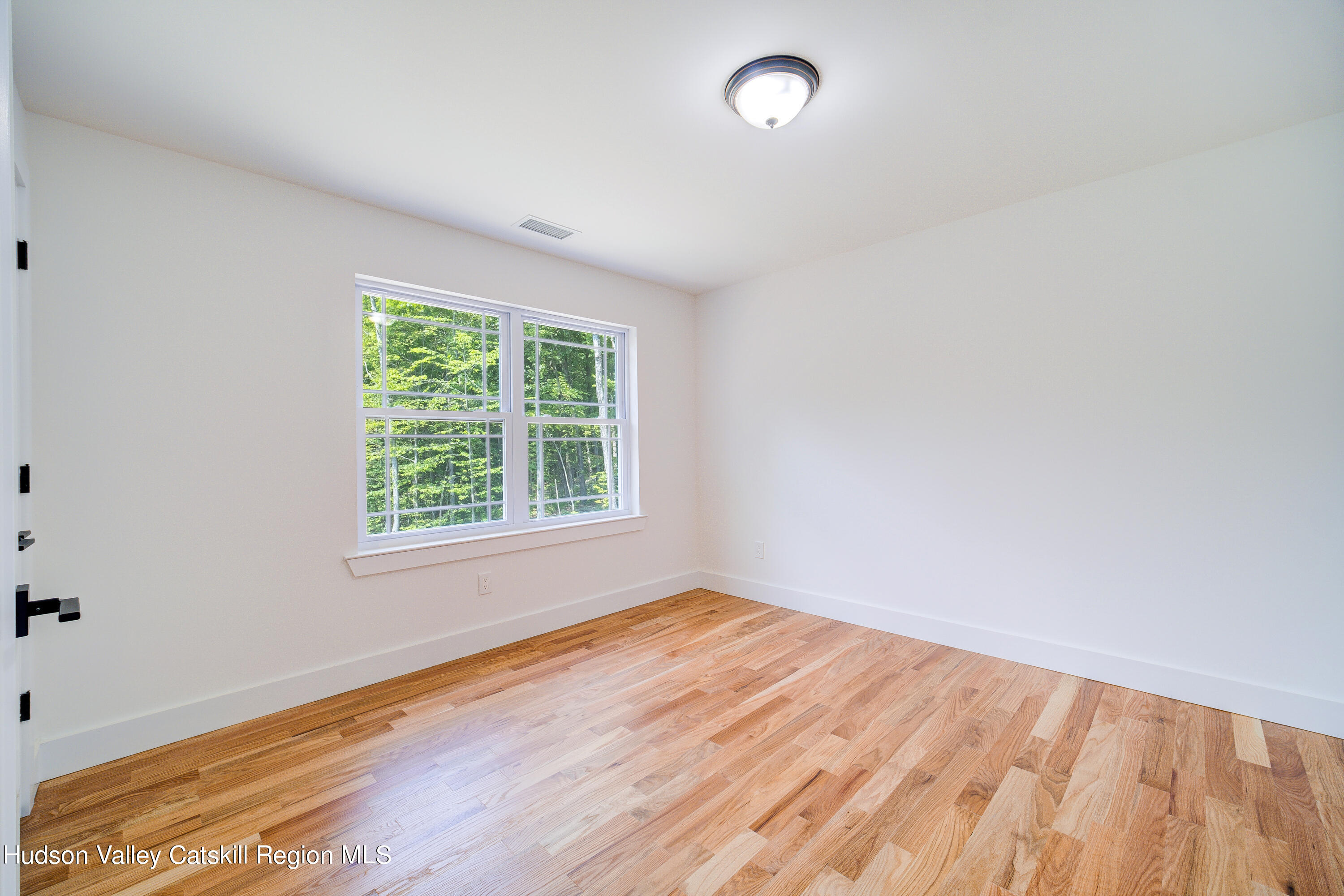 3 Calico Way, Unit WAYS Wallkill, NY 12589 - Photo 40 of 68 an empty room with wooden floor and windows