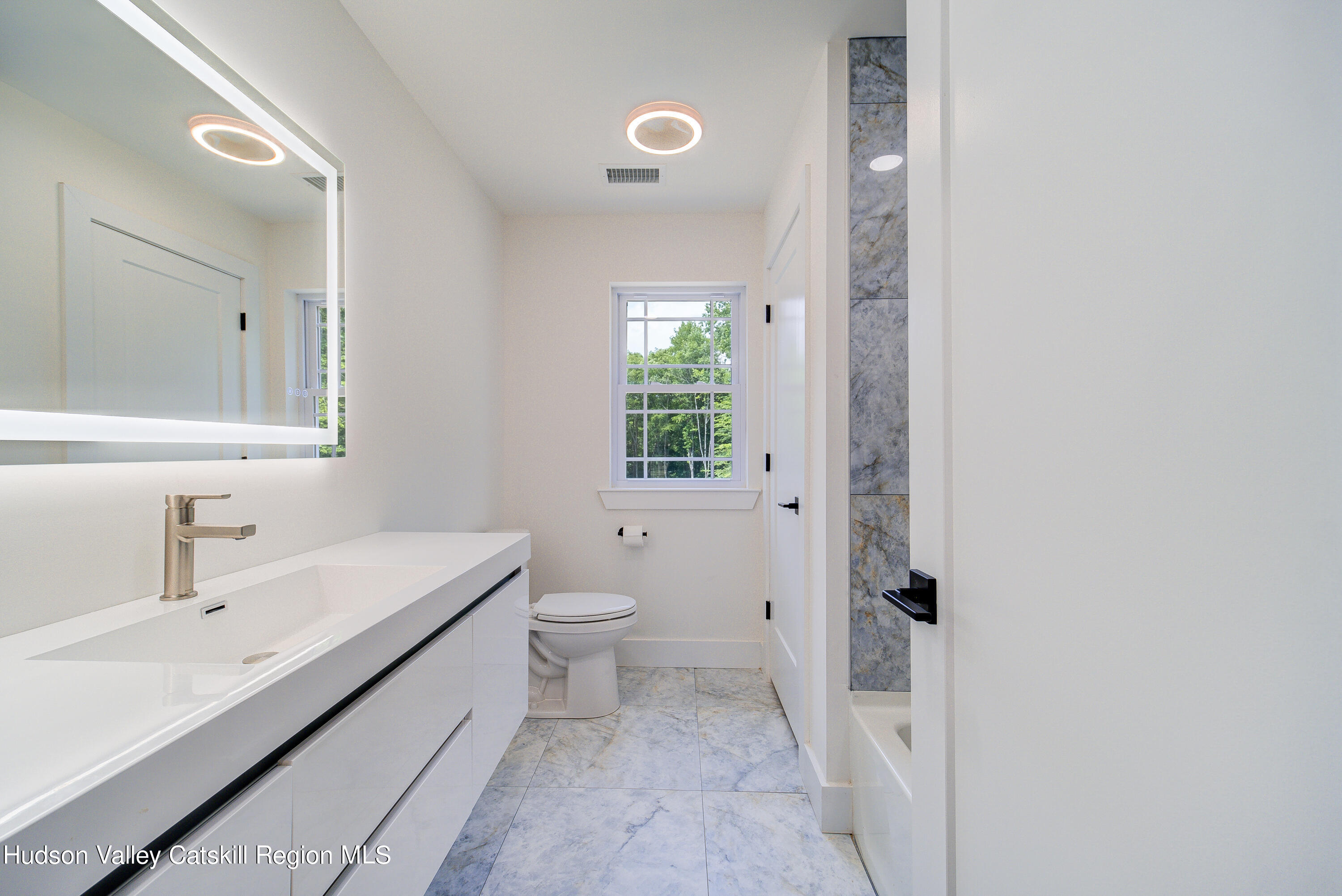 3 Calico Way, Unit WAYS Wallkill, NY 12589 - Photo 45 of 68 a bathroom with a sink and a mirror