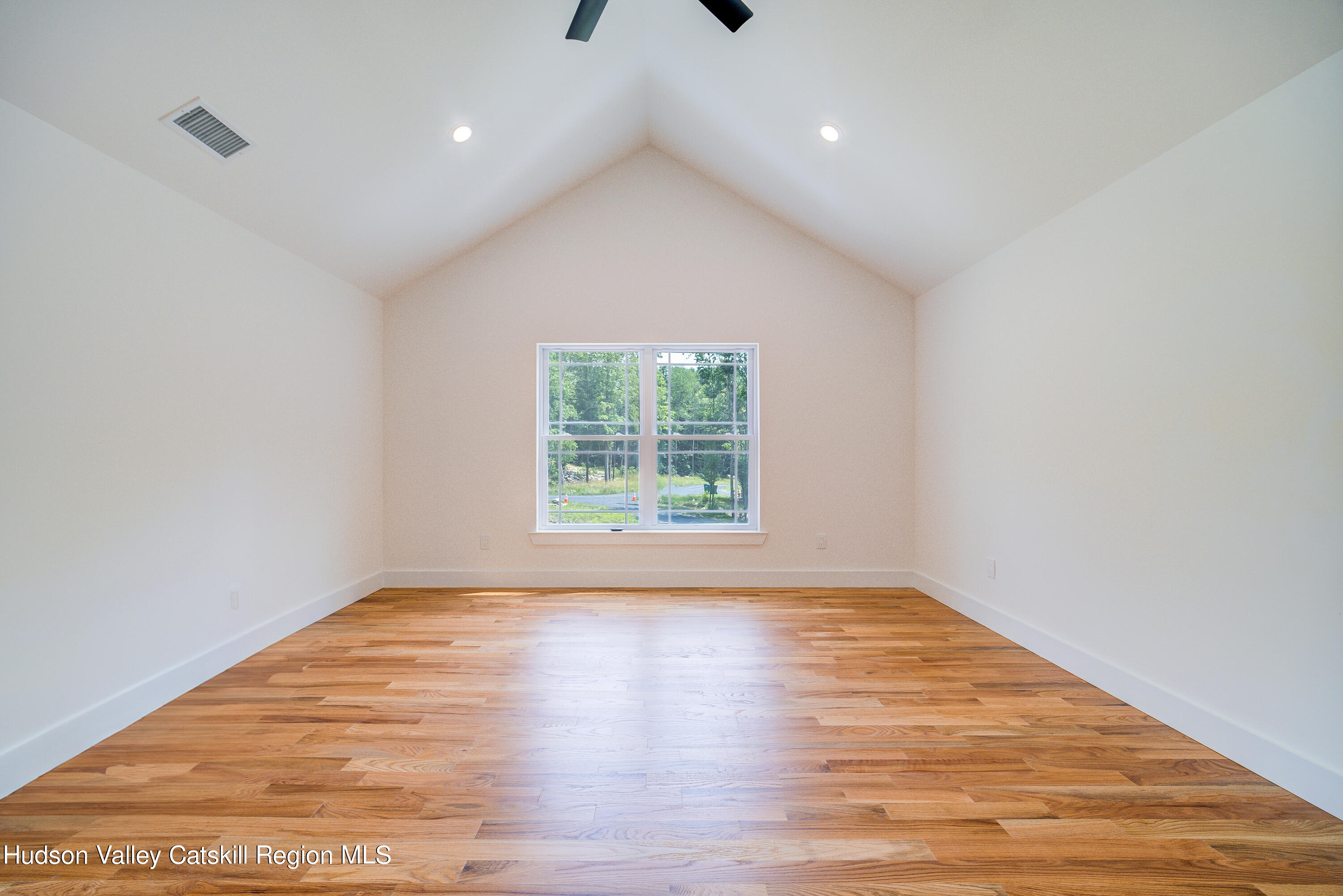 3 Calico Way, Unit WAYS Wallkill, NY 12589 - Photo 48 of 68 a view of an empty room with wooden floor and a window