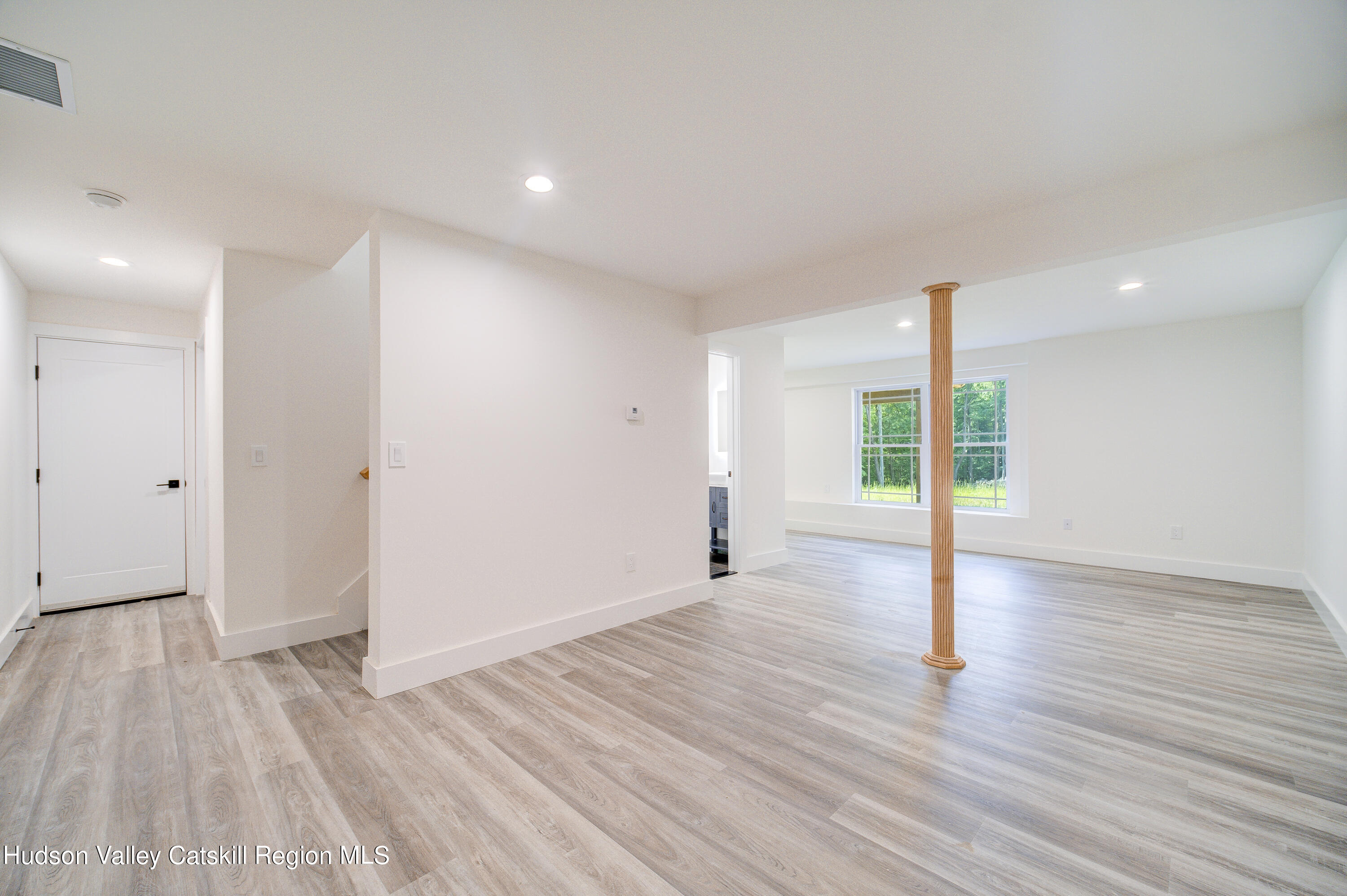 3 Calico Way, Unit WAYS Wallkill, NY 12589 - Photo 56 of 68 a view of an empty room with wooden floor and a window