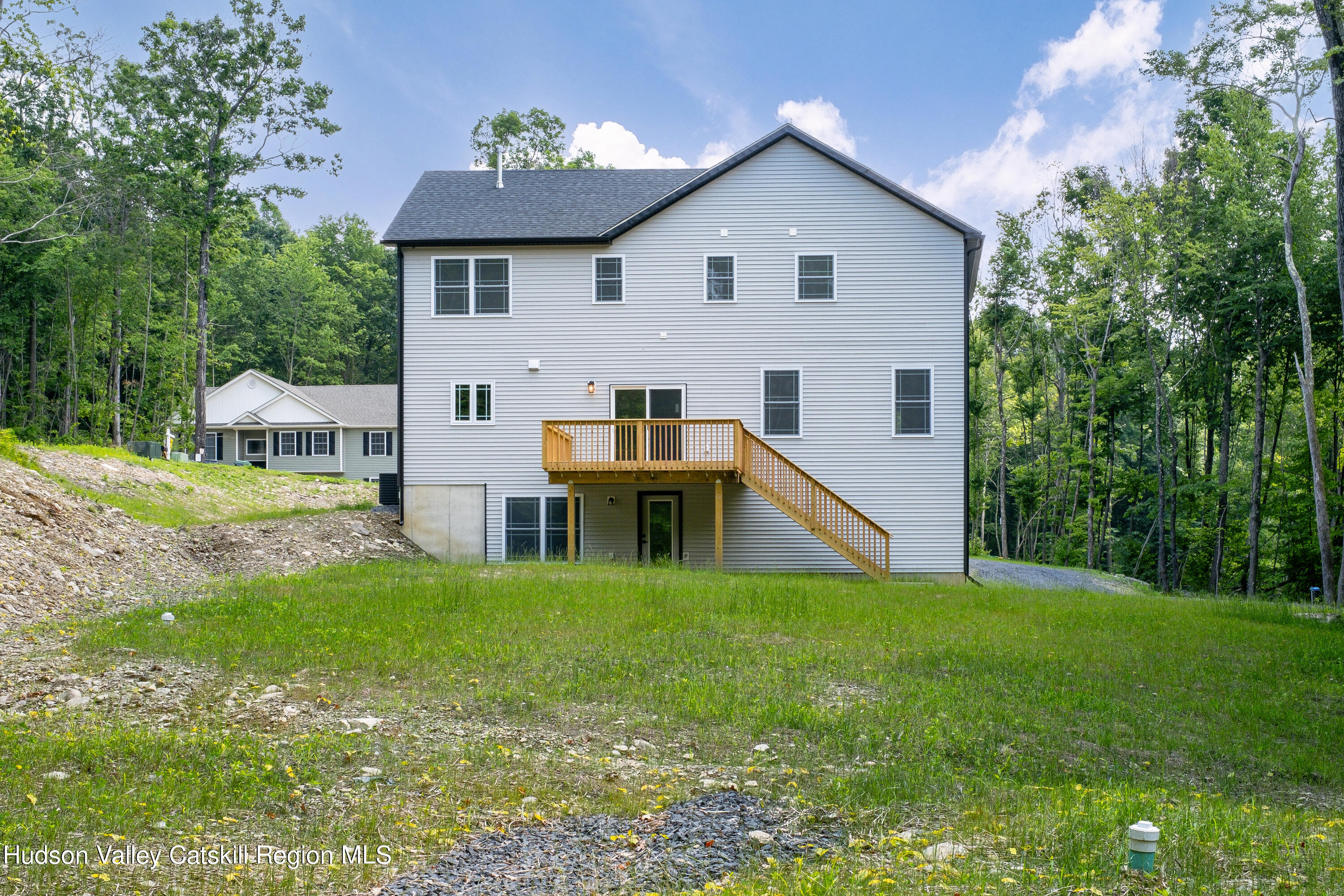 3 Calico Way, Unit WAYS Wallkill, NY 12589 - Photo 67 of 68 a view of a house with a yard porch and sitting area
