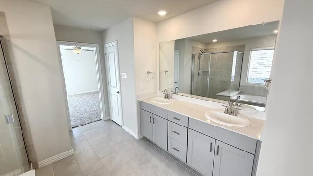 a bathroom with a double vanity sink mirror and double