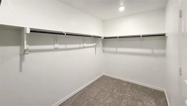 a view of an empty walk in closet