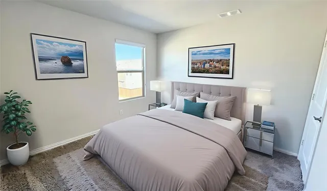 a bed room with a bed and a potted plant