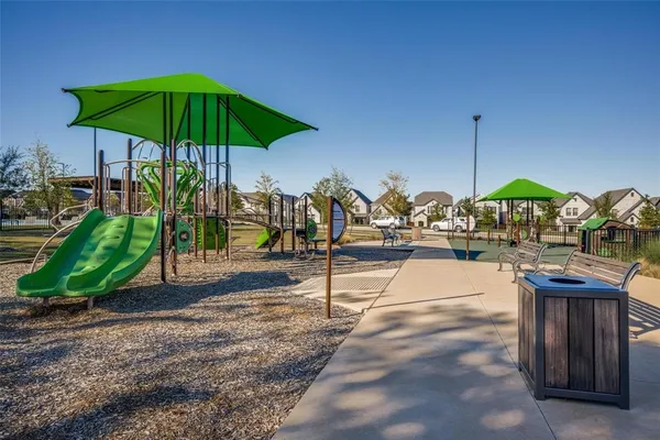 a view of a backyard with sitting area