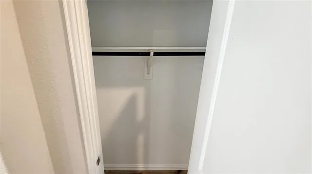 a view of walk in closet with window