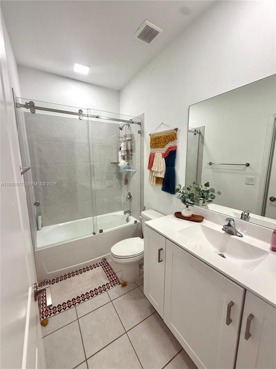 10066 Southwest 228th Terrace Miami, FL 33190 - Photo 15 of 42 a bathroom with a sink a toilet and shower