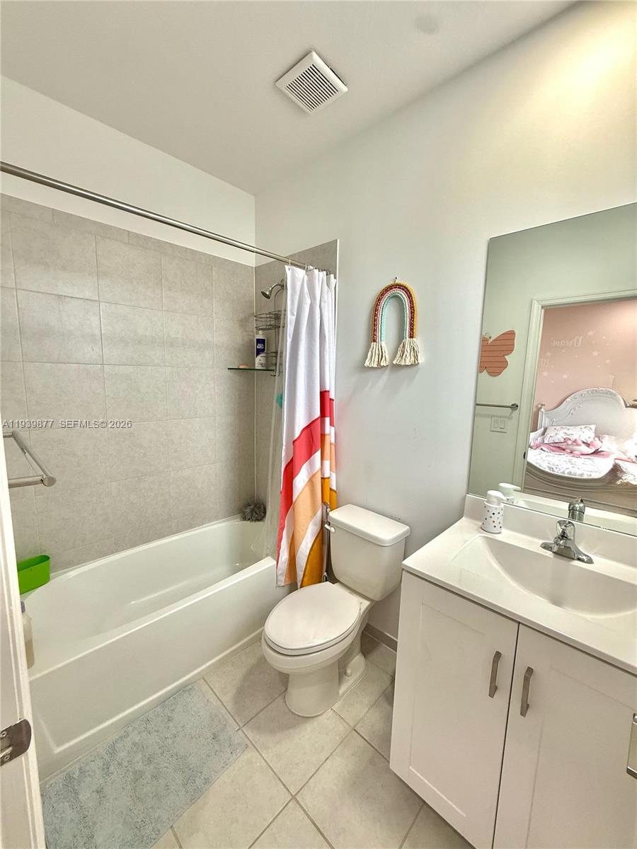 10066 Southwest 228th Terrace Miami, FL 33190 - Photo 22 of 42 a bathroom with a sink toilet and shower