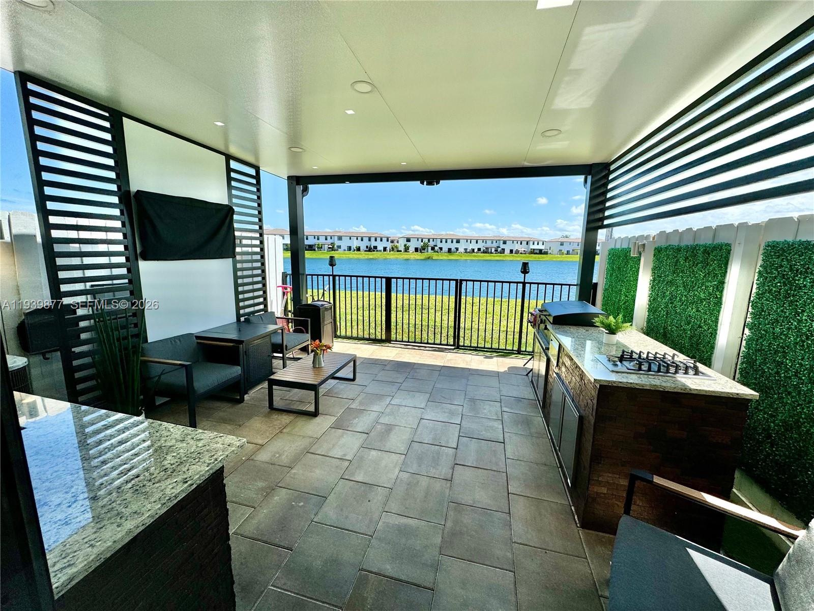 10066 Southwest 228th Terrace Miami, FL 33190 - Photo 3 of 42 a lobby with furniture and window