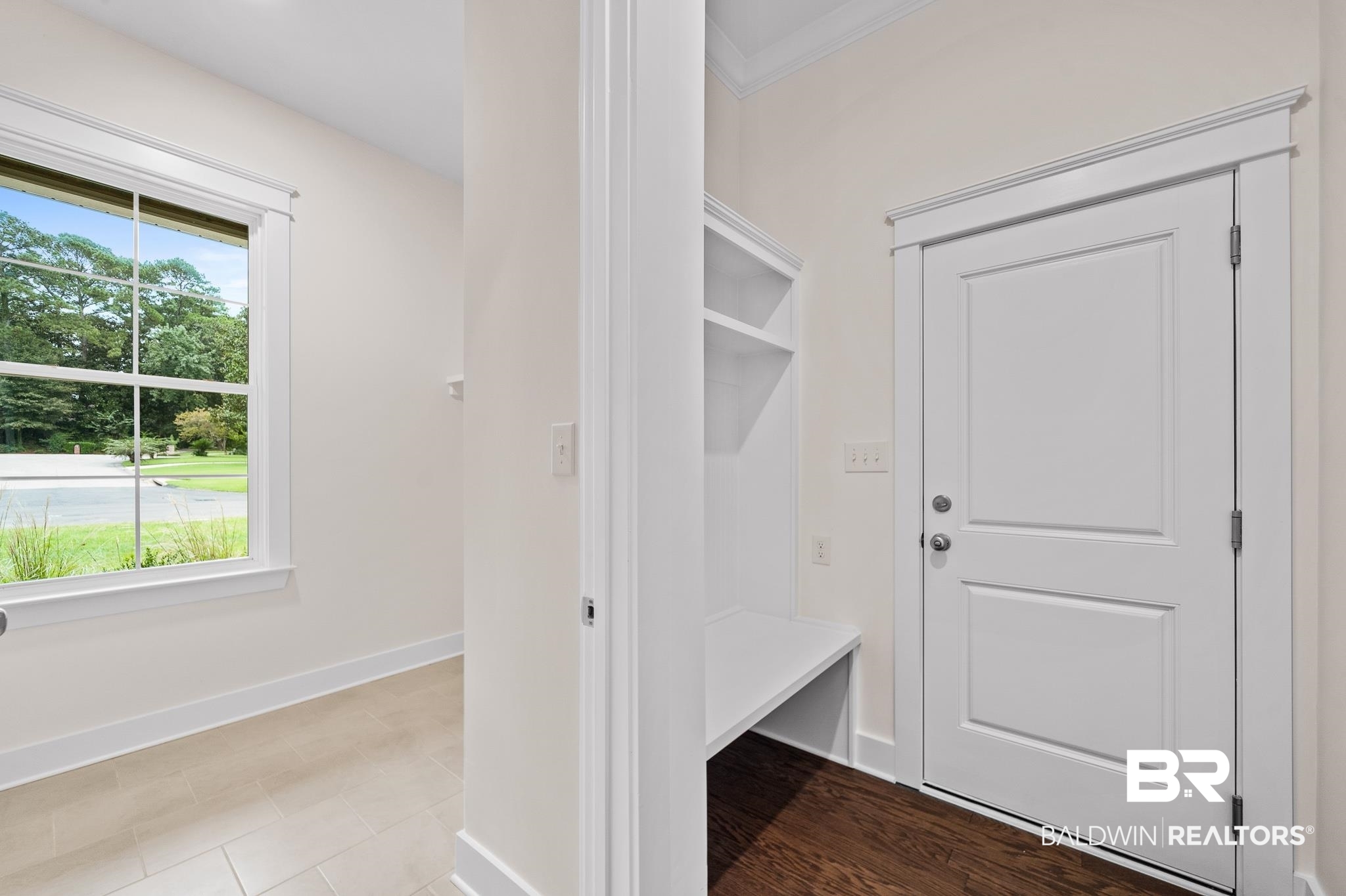 29 Signal Hill Road Daphne, AL 36527 - Photo 16 of 36 Mudroom featuring hardwood / wood-style flooring, plenty of natural light, and ornamental molding