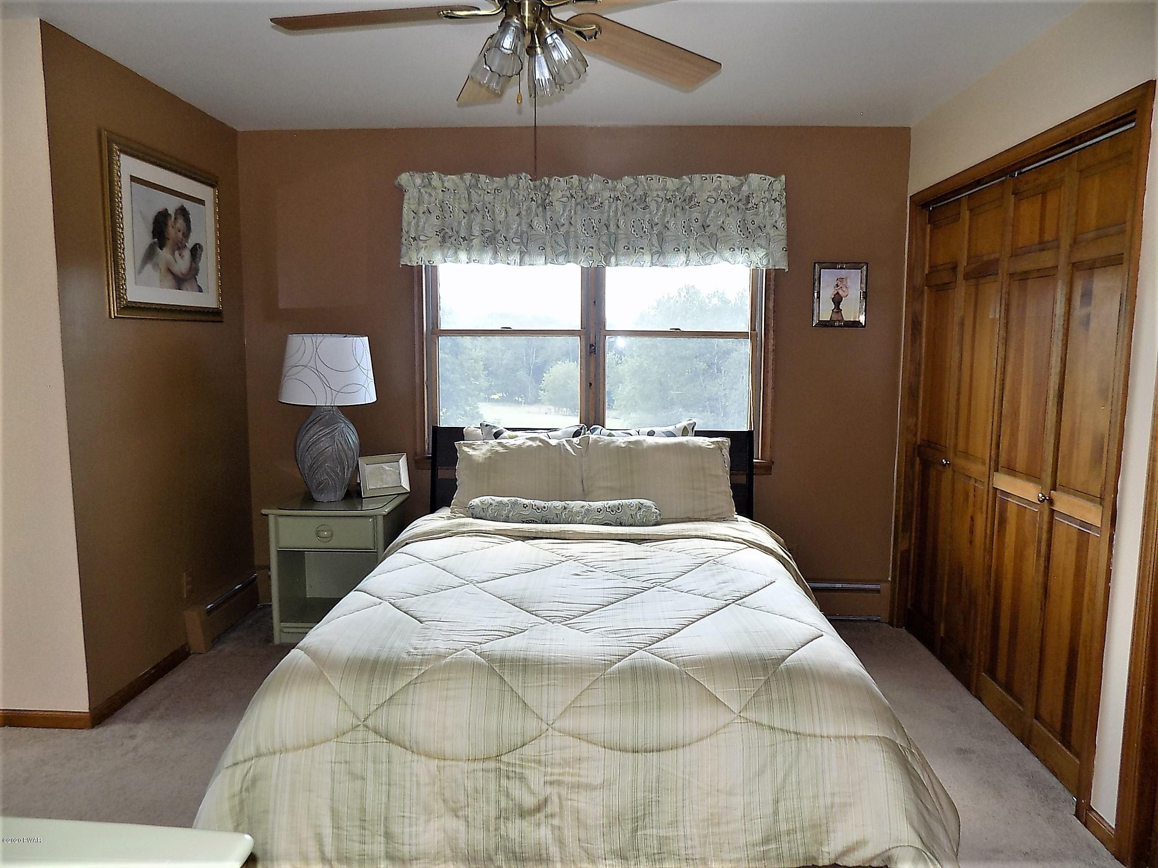 171 Valleyview Road Greentown, PA 18426 - Photo 79 of 111 a bedroom with a bed and a window