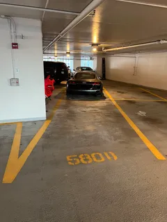 a view of parking garage with cars