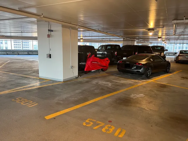 a view of parking space with parked cars