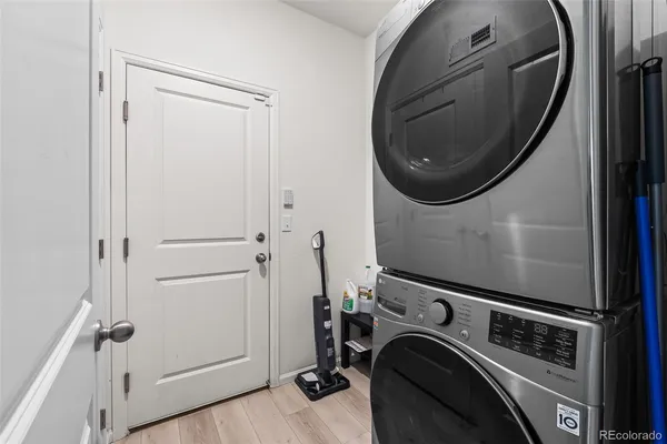 a view of a storage and utility room with washer and dryer