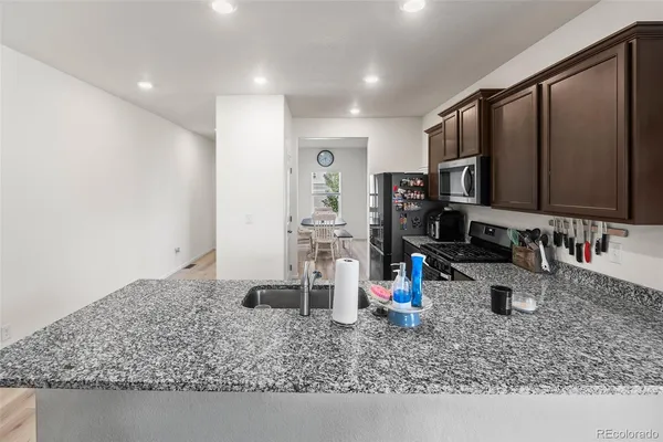 a view of a sink and a wooden floor