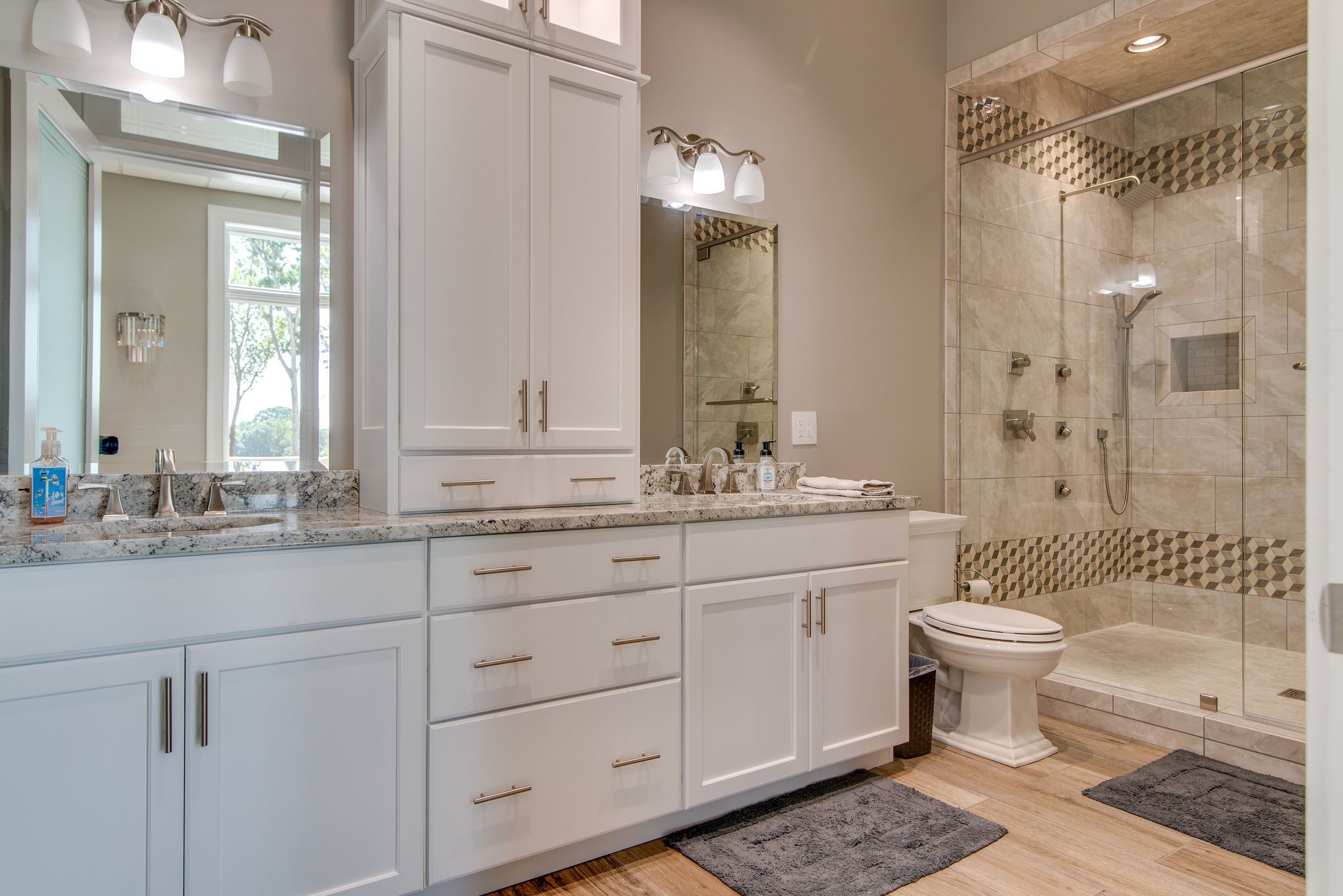 5156 Turney Groce Road Byrdstown, TN 38549 - Photo 43 of 68 a bathroom with a sink toilet a mirror and shower