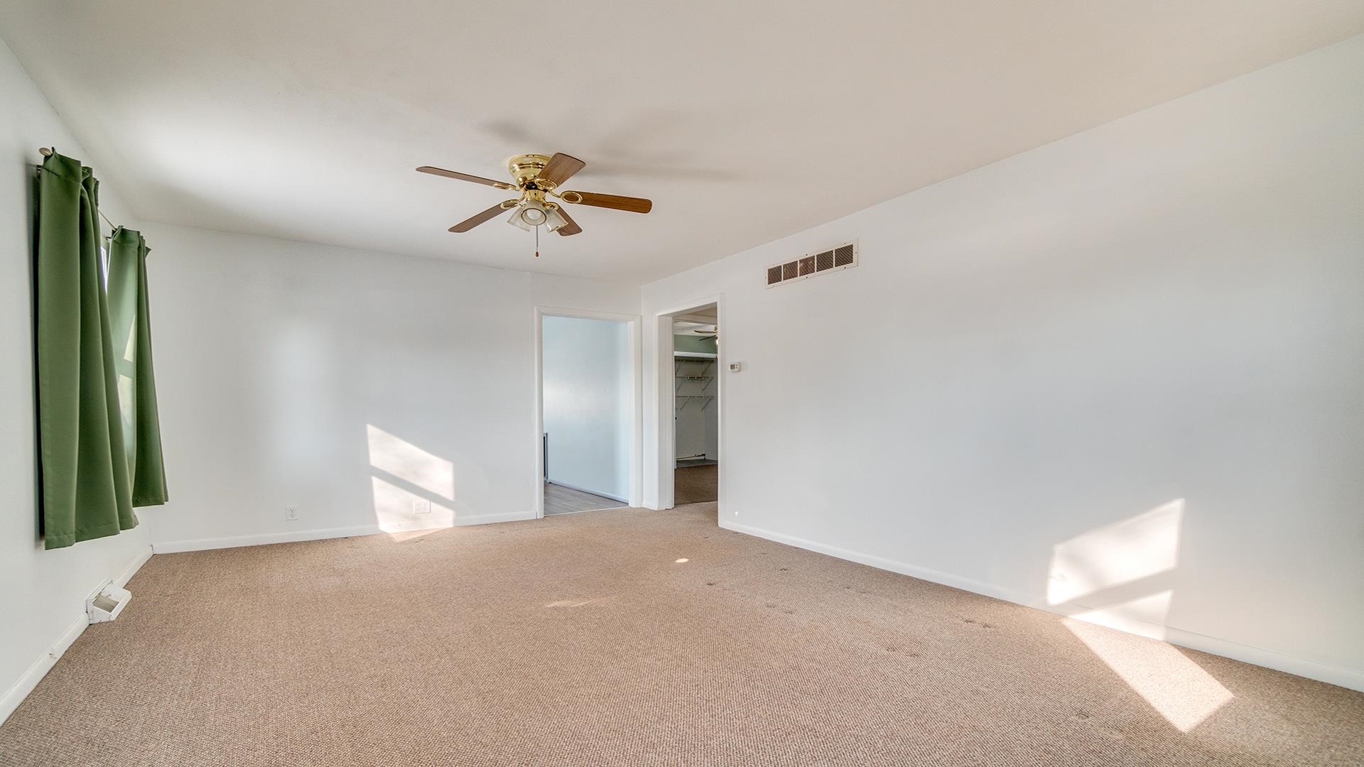 567 South 2nd Street Rochelle, IL 61068 - Photo 4 of 20 a view of a room with window and ceiling fan